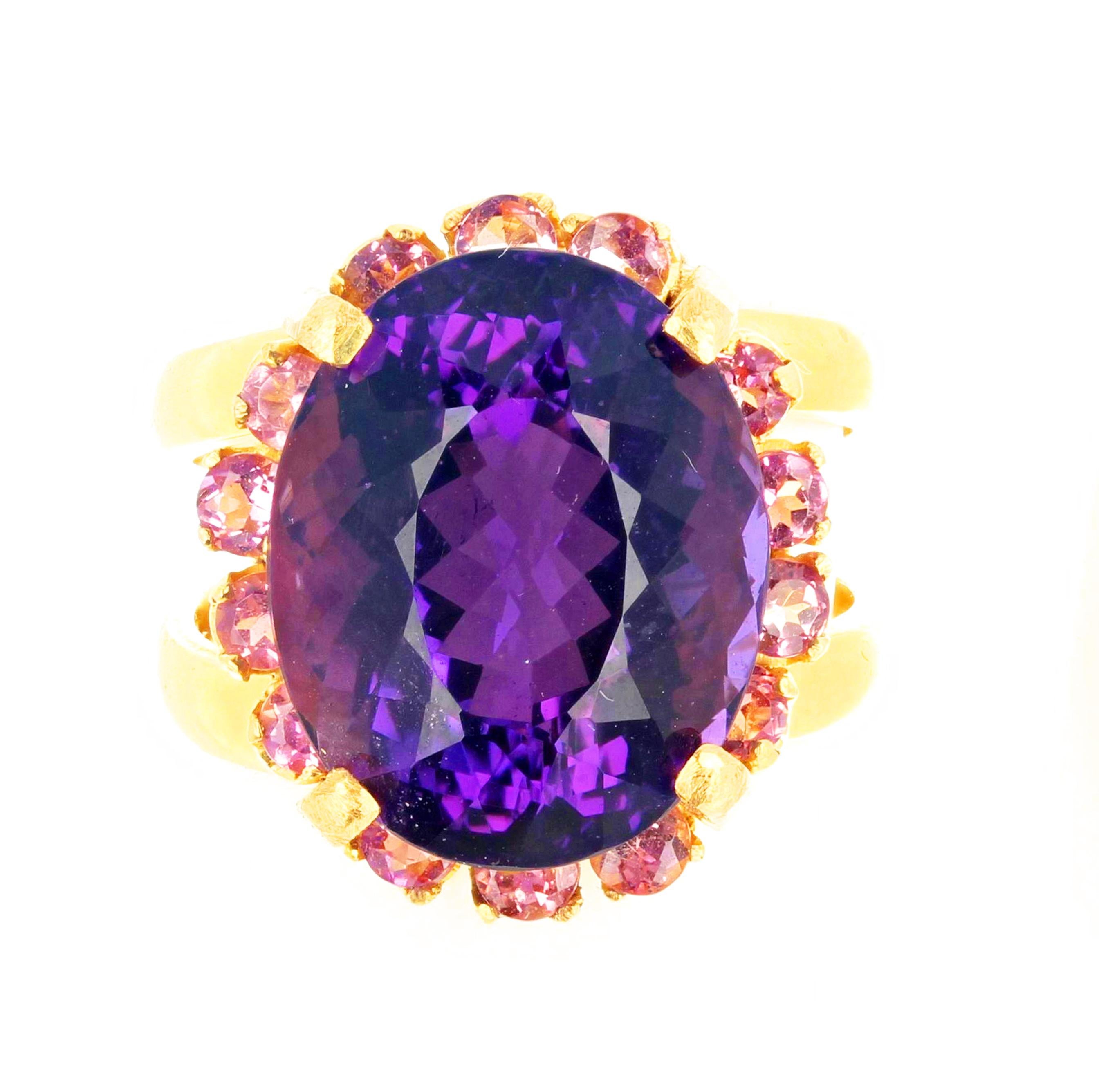 Glittering bright 10 CT Amethyst enhanced with round sparkling pink Tourmalines set in 14 KT handmade yellow gold ring size 7 (sizable for free).  The Amethyst is 15.5 mm x 12.5 mm.  If you wish faster delivery on your purchase choose UPS to ship