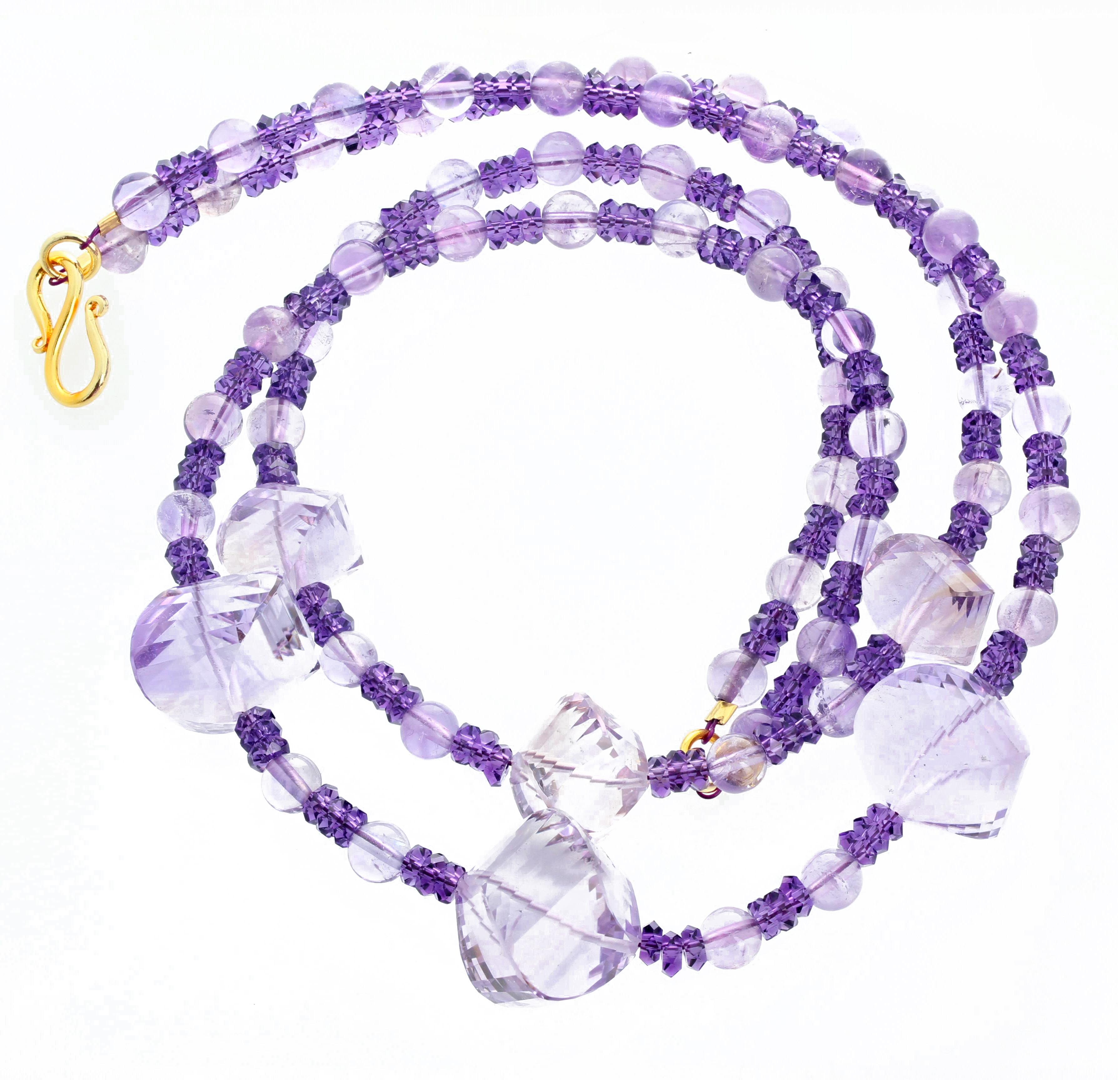 This AJD unique double strand of highly polished glittering Rose of France Amethysts are enhanced with round polished Rose of France and accented with bright gem cut glittering Amethyst rondels set in this 16 inch long necklace.  The largest