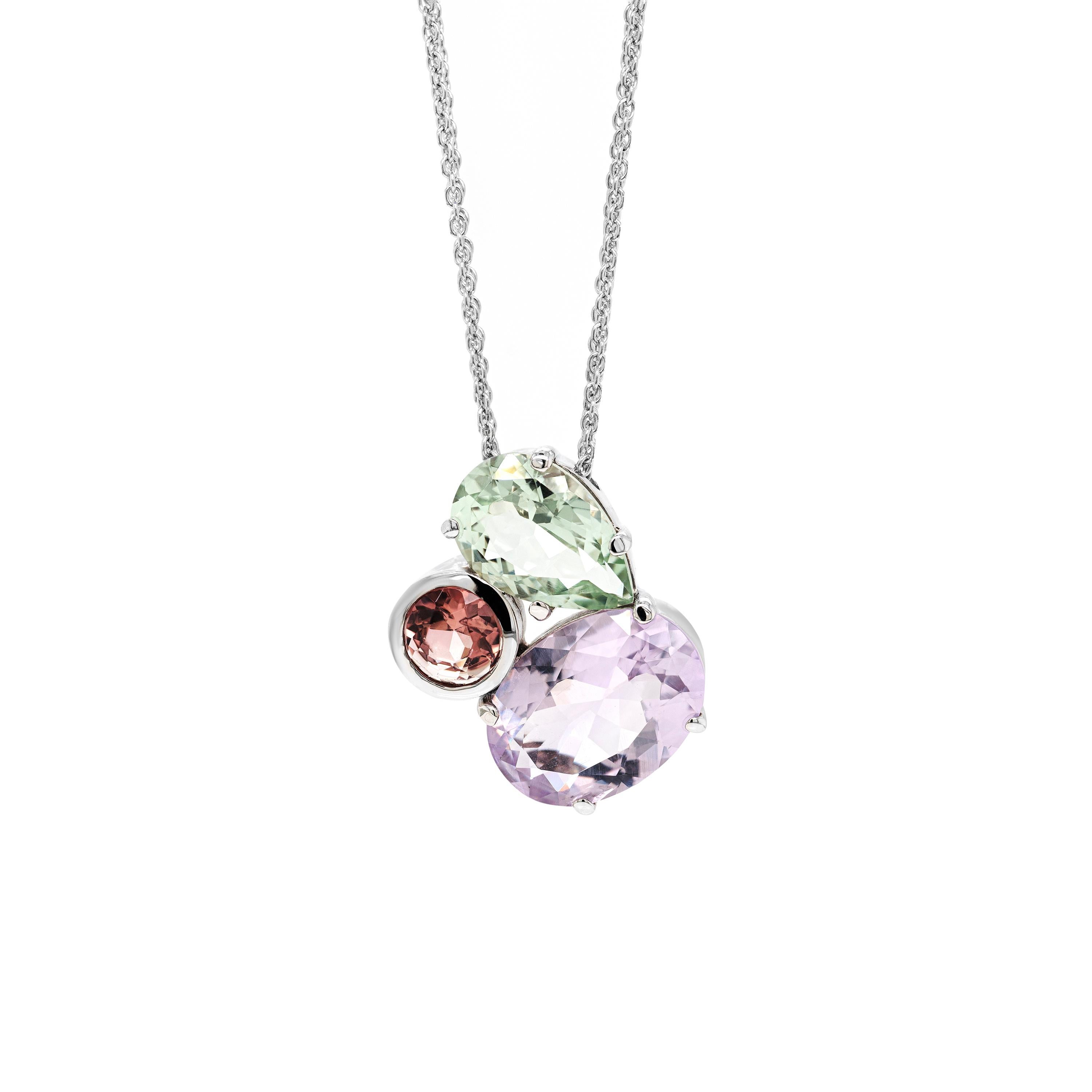 Meticulously crafted and set with a variety of stone shapes and colours, this beautiful 18 carat white gold set consists of a pendant necklace and matching earrings.
The colourful pendant is beautifully adorned with a 12x8.3mm pear shaped green