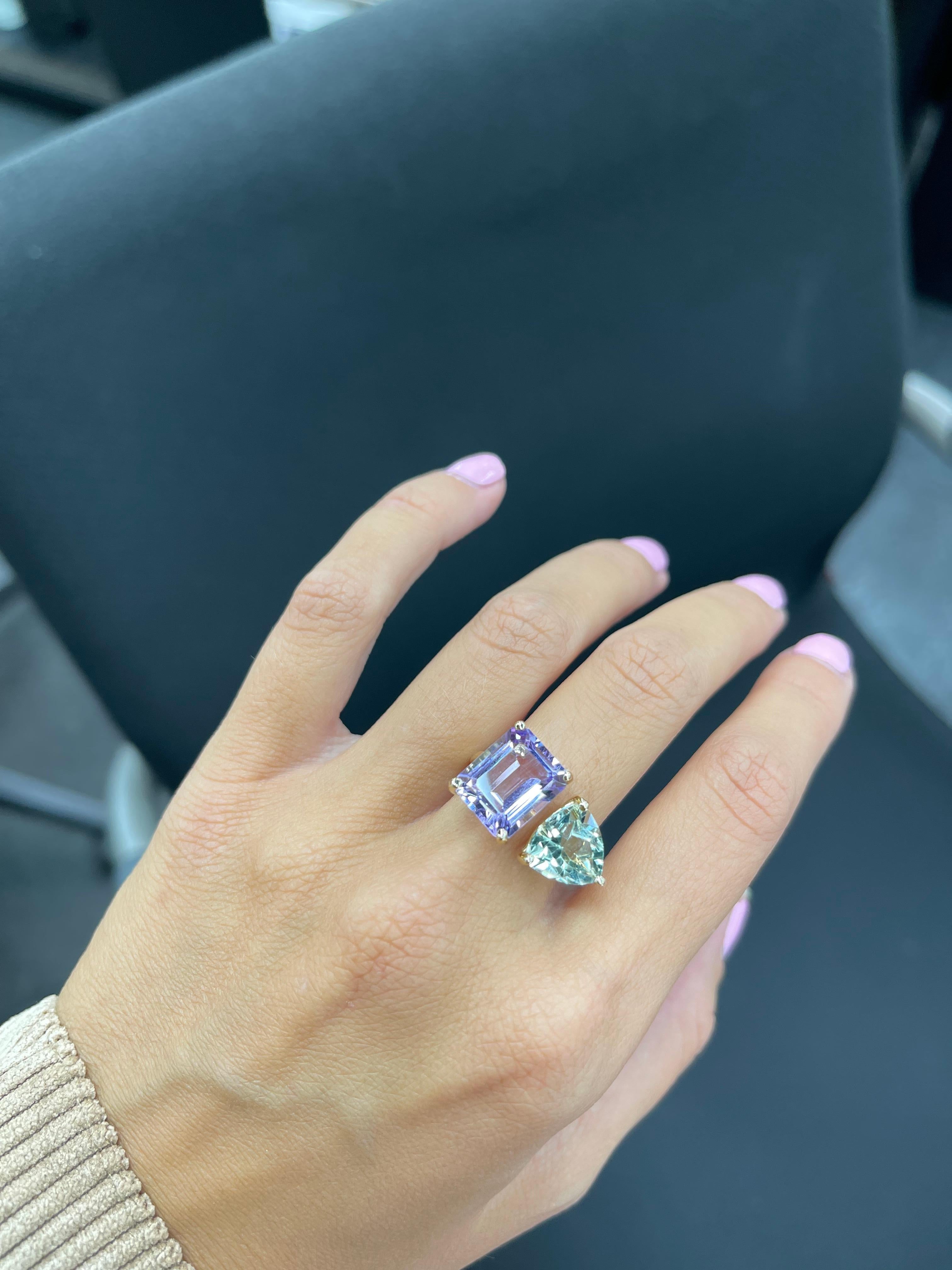 one of a kind ring, custom made by our jewelers 
Emerald cut Amethyst 5.32 cts
trillion Tourmaline 3.10 cts.