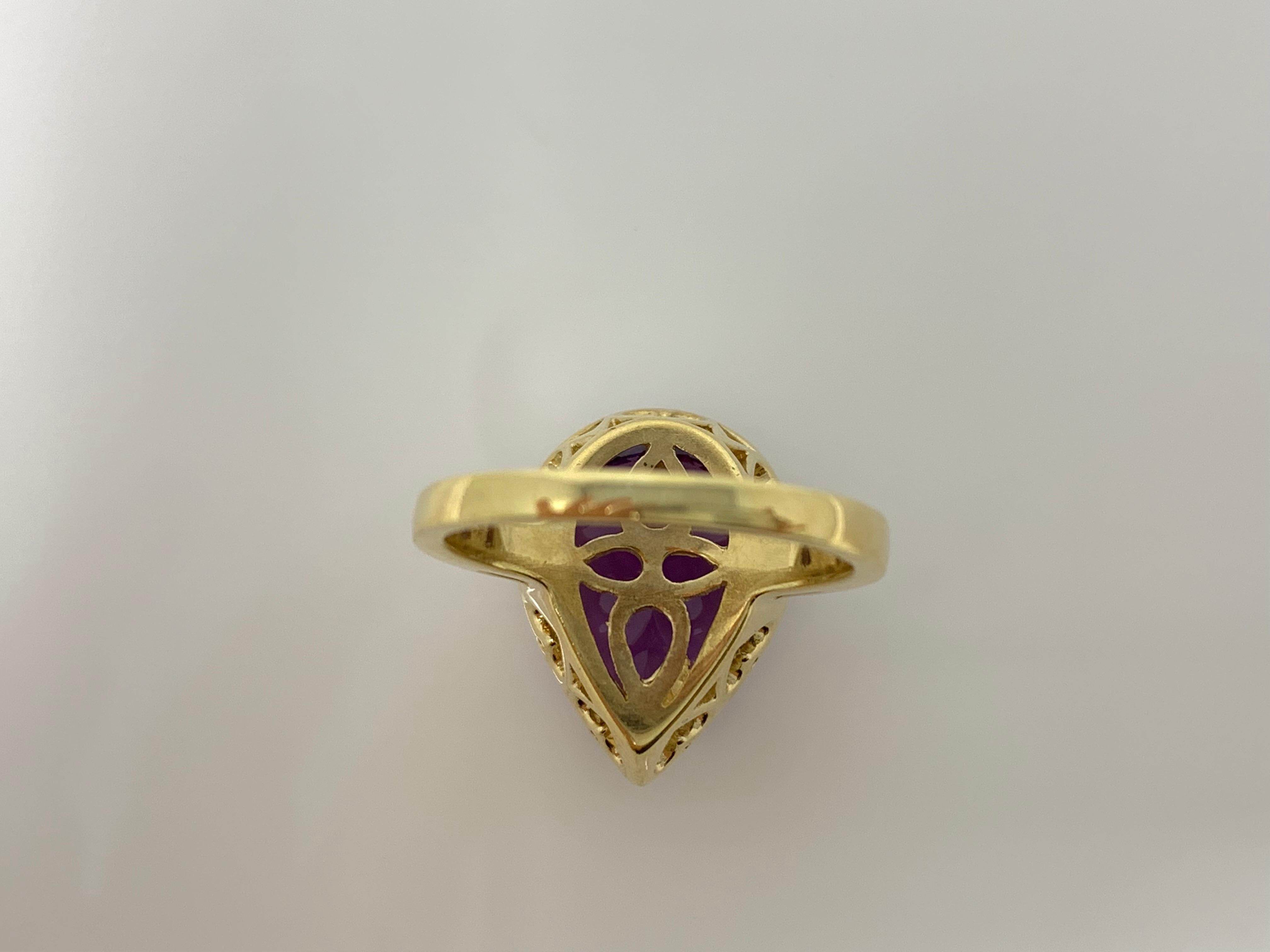 This big and dramatic Amethyst and white diamond ring features a large Amethyst weighing 5 carat in the center with halo of small white diamonds weighing 0.50 carat with VS clarity and GH color. This piece is created by hand in 14k yellow gold and