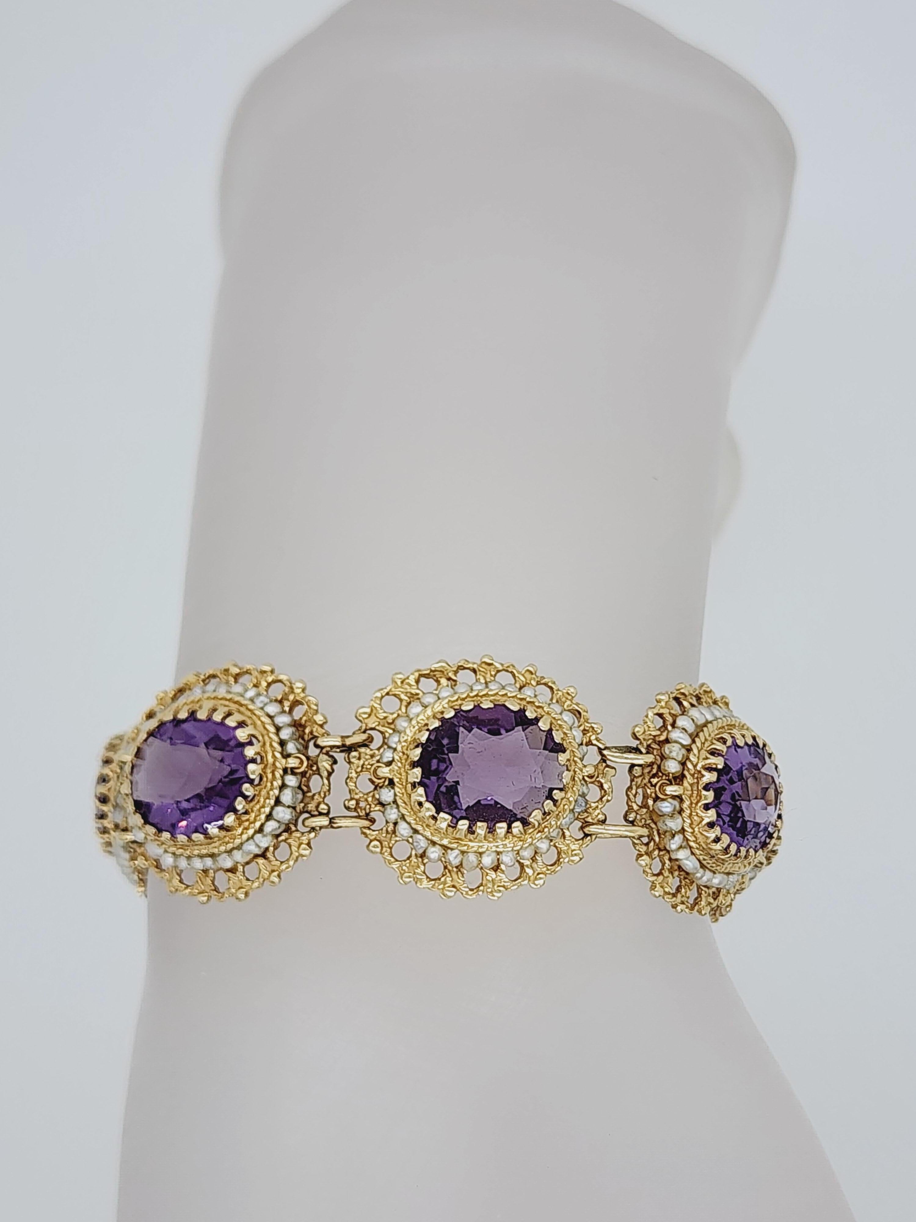 Beautiful 8 amethyst ovals and white pearls in a handmade in 14k yellow gold mounting.  Length is 7