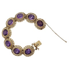 Armband aus 14 Karat Gelbgold mit Amethyst und weißen Perlen