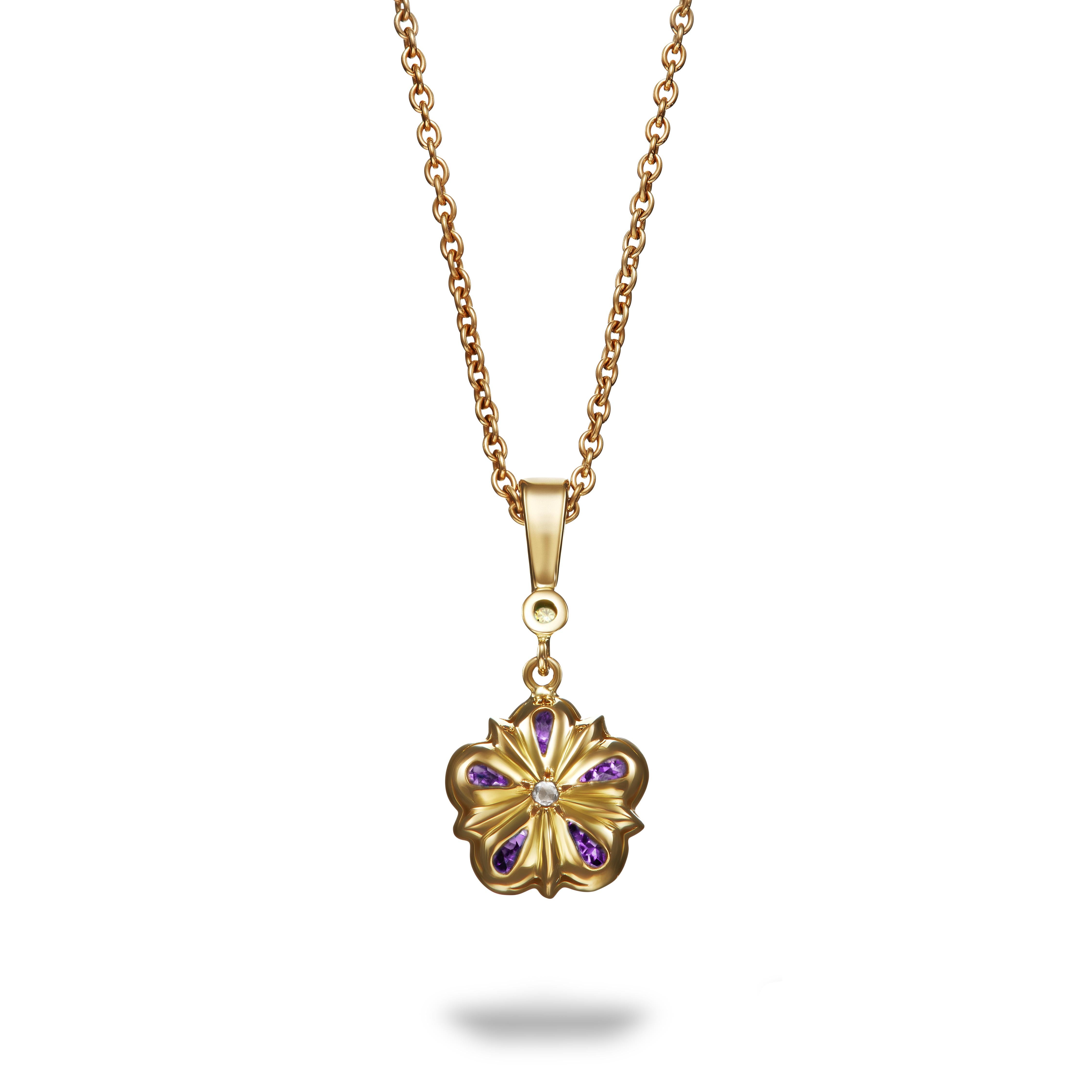 This unique amethyst and natural yellow diamond Rose pendant features colourful amethysts surrounding a vibrant natural yellow round brilliant cut diamond. The pendant is suspended from an 18k yellow gold bail with another lovely matching yellow