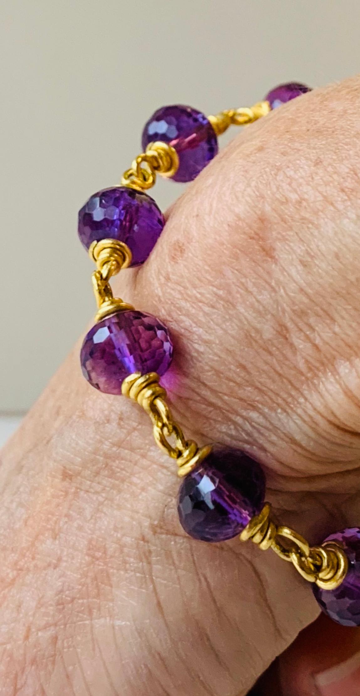 This comfortable and easy to wear  bracelet is in 22 Karat gold with toggle clasp & 3/8 inch amethyst beads. The beads are faceted, very lively and clean. 
Handmade by the artist in New York .
