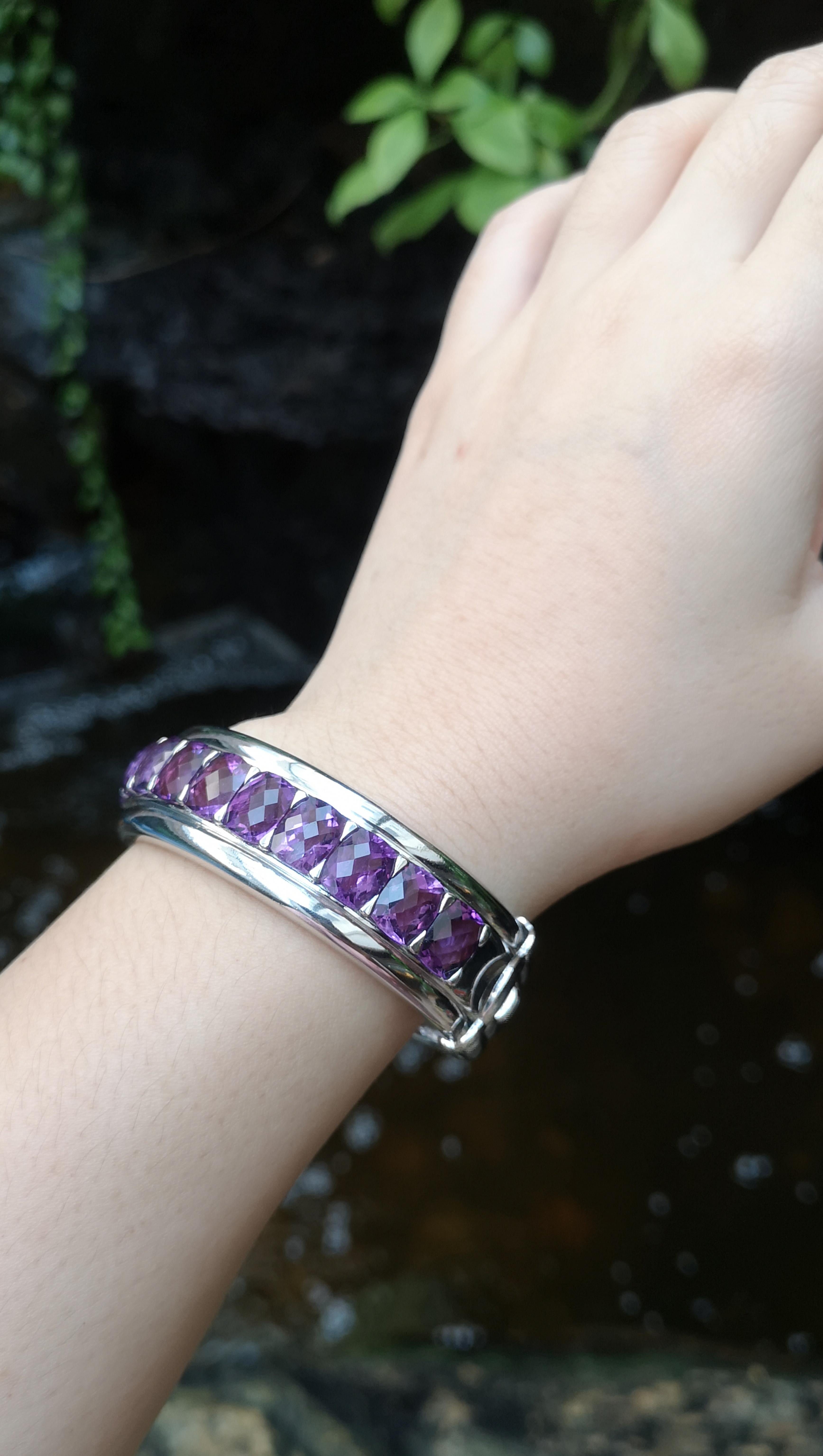 Amethyst 31.18 carats Bangle set in Silver Settings

Diameter:  6.7 cm 
Length: 2.0 cm
Total Weight: 57.28 grams

*Please note that the silver setting is plated with rhodium to promote shine and help prevent oxidation.  However, with the nature of