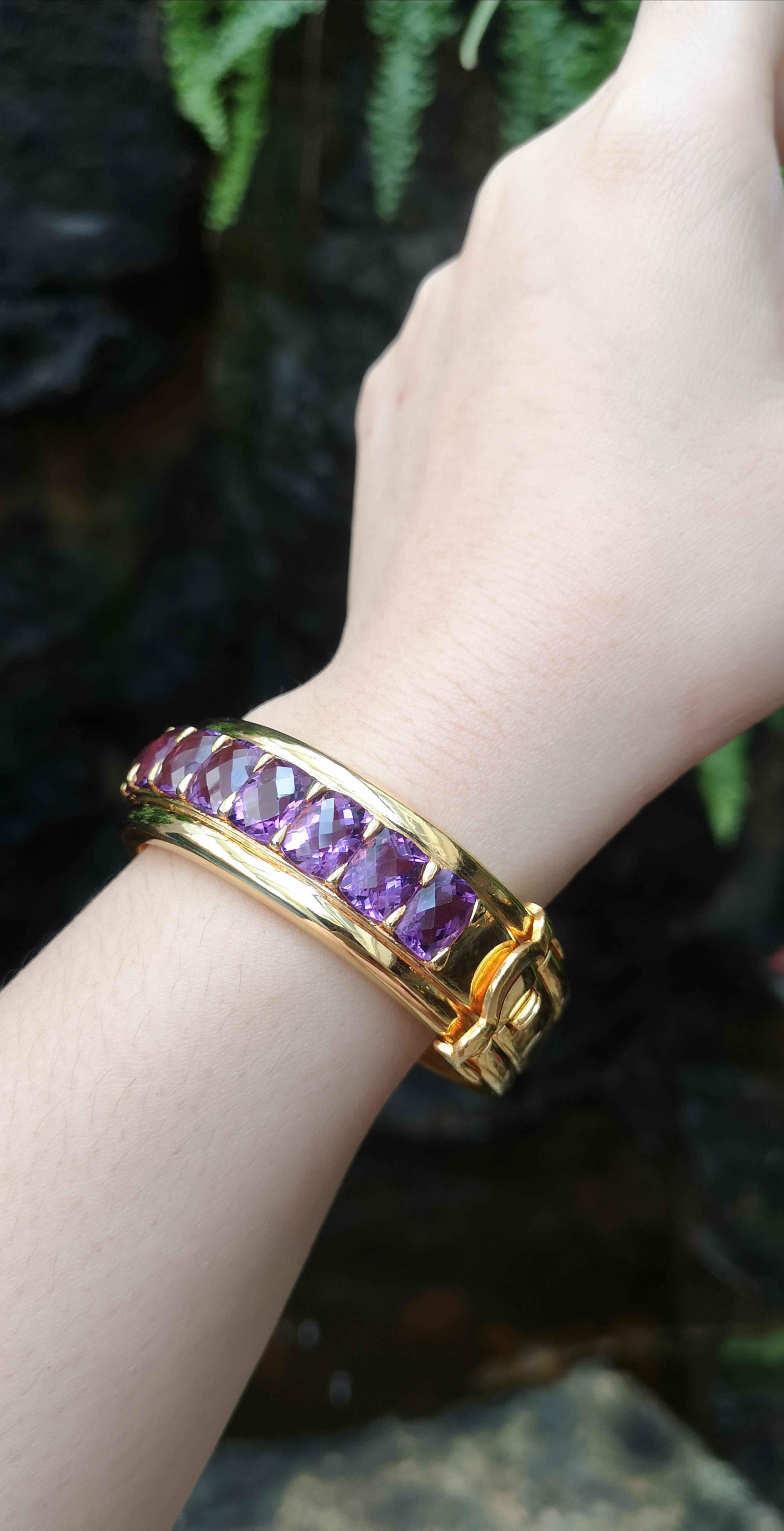 Amethyst 29.64 carats Bangle set in Silver Settings

Diameter:  6.4 cm 
Length: 2.0 cm
Total Weight: 62.5  grams

*Please note that the silver setting is plated with gold to promote shine and help prevent oxidation.  However, with the nature of