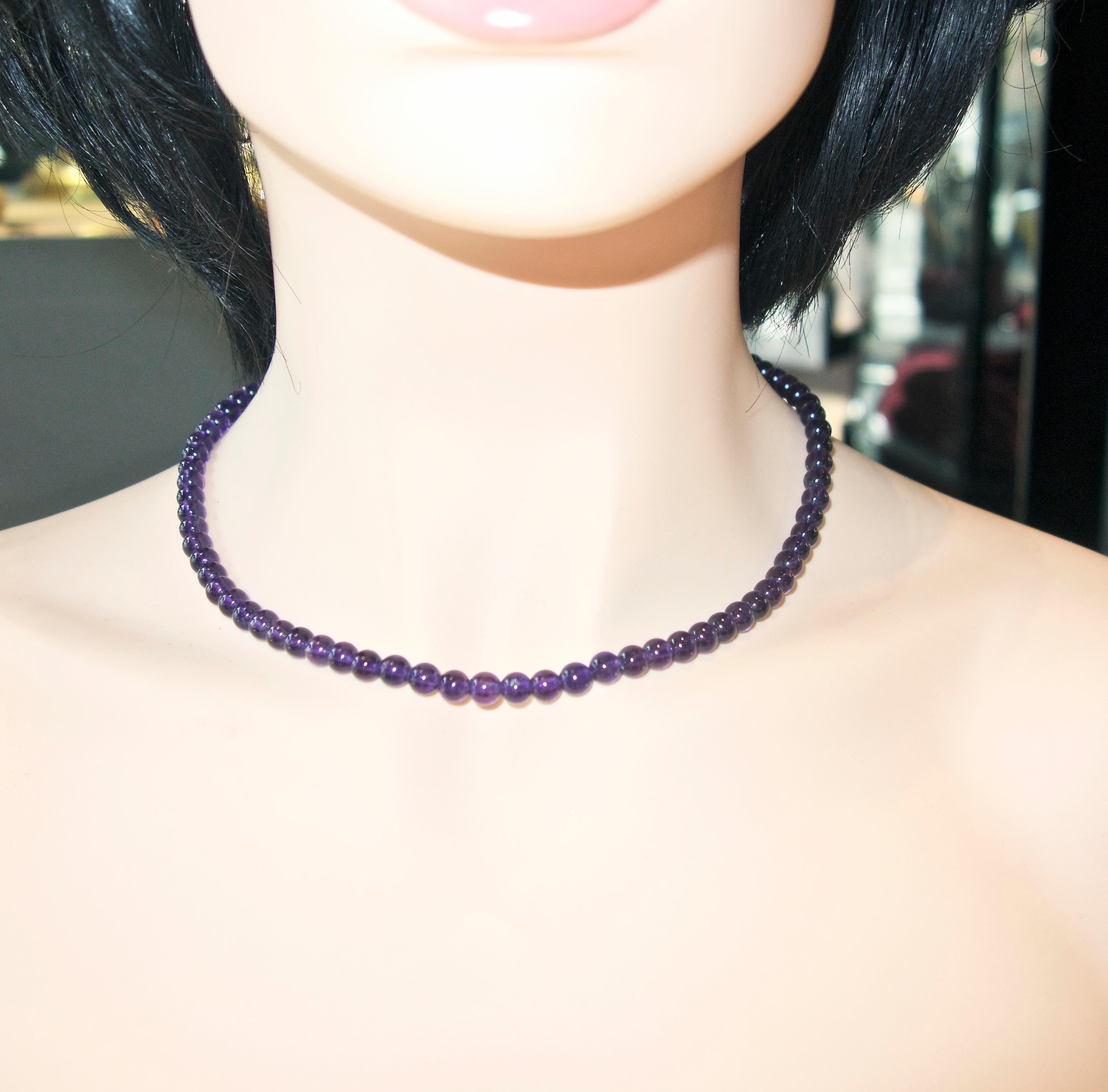 Natural amethyst necklace of deep purple color, the 66 amethysts are well matched and are 6.2 to 6.4 mm. in size.  The necklace is 16.5 inches long with a fish hook type gold color clasp.