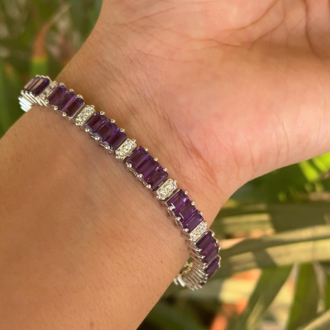 Amethyst Birthstone 16.95 Carats Tennis Silver Bracelet  in sterling silver showcases endlessly sparkling natural amethyst, weighing 16.95 carat. It measures 7 inches long in length.
Amethyst stimulate concentration and reduces stress. 
Designed
