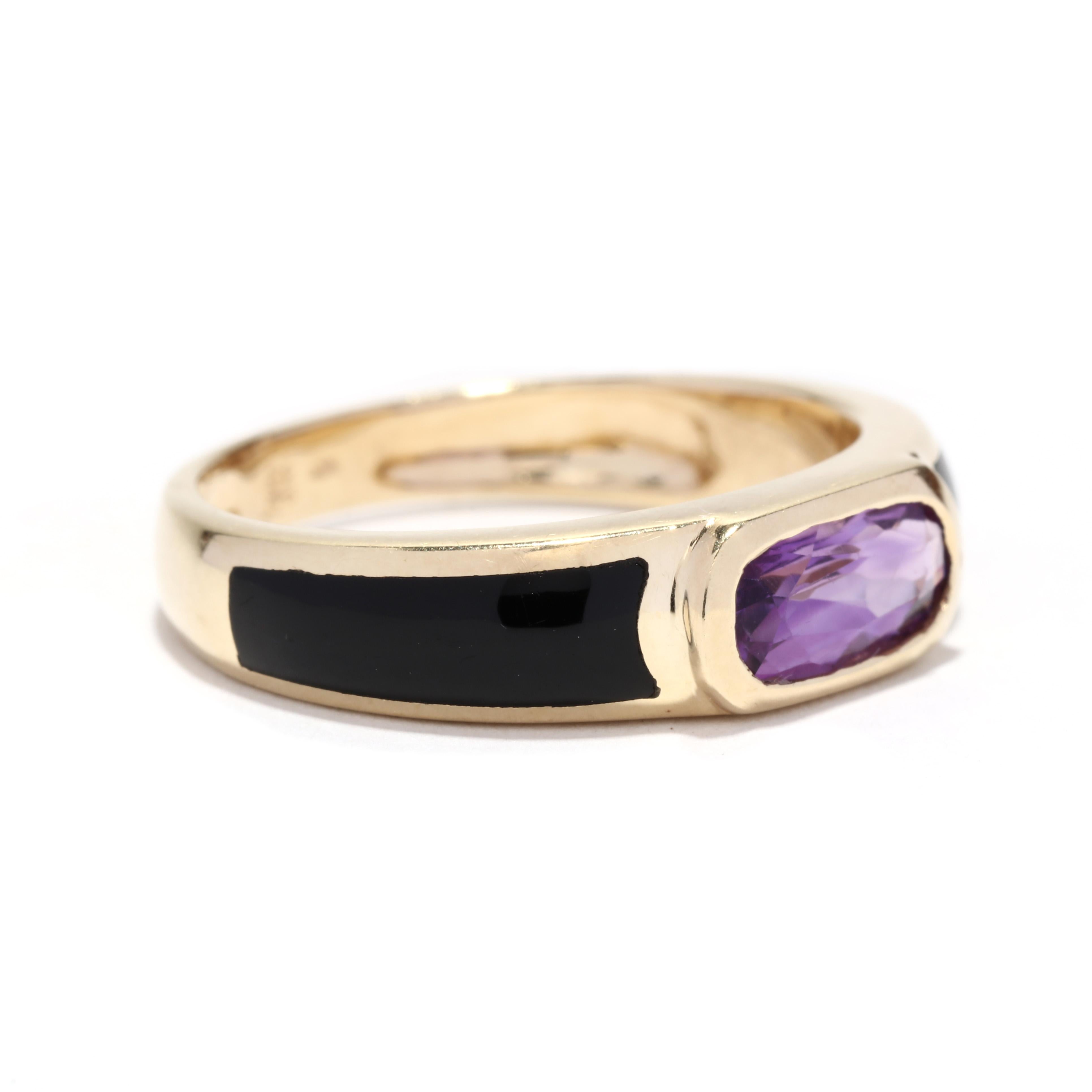 A vintage 14 karat yellow gold amethyst and black onyx ring. This stackable ring features a bezel set, oblong oval cut amethyst weighing approximately .60 carat with a custom cut tapered black onyx stone on either side.

Stones: 
- amethyst, 1