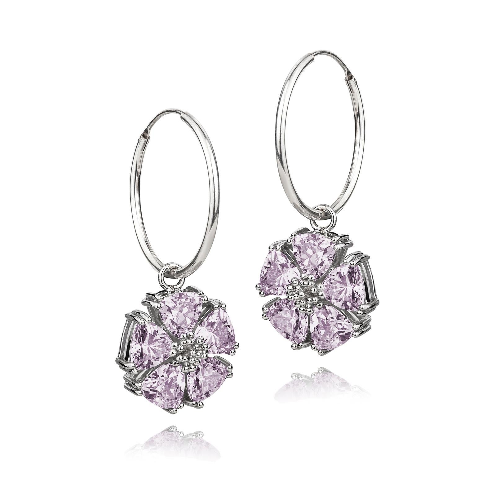 Designed in NYC

.925 Sterling Silver 10 x 7 mm Amethyst Blossom Stone Dangle Hoops. No matter the season, allow natural beauty to surround you wherever you go. Blossom stone dangle hoops: 

	Sterling silver 
	High-polish finish
	Light-weight