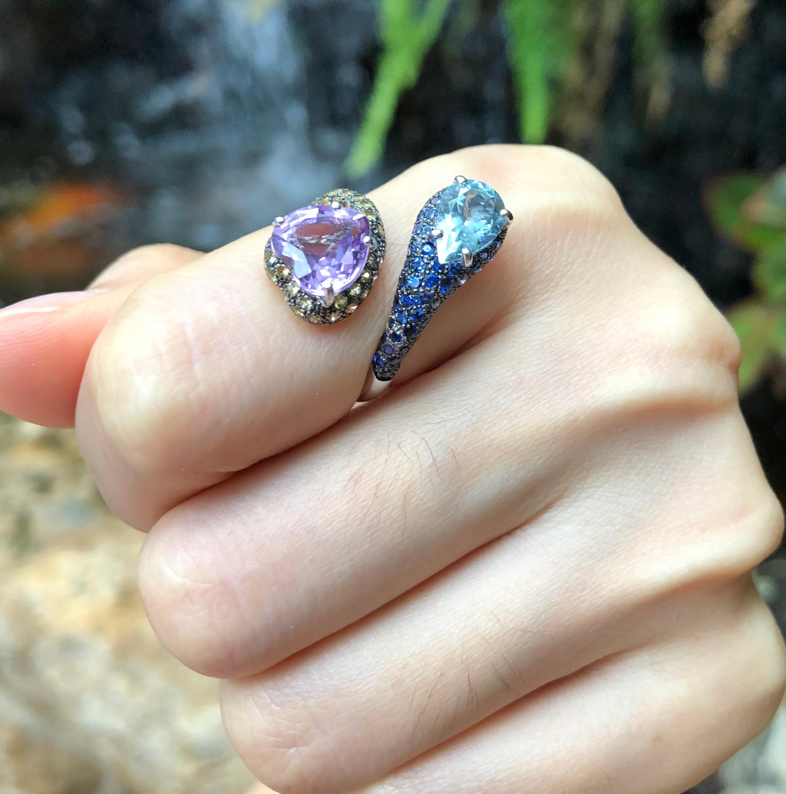 Amethyst 2.05 carats, Blue Topaz 1.15 carats with Yellow Sapphire 0.74 carat and Blue Sapphire 0.83 carat Ring set in 18 Karat White Gold Settings

Width:  1.9 cm 
Length:  2.2 cm
Ring Size: 50
Total Weight: 5.87 grams

