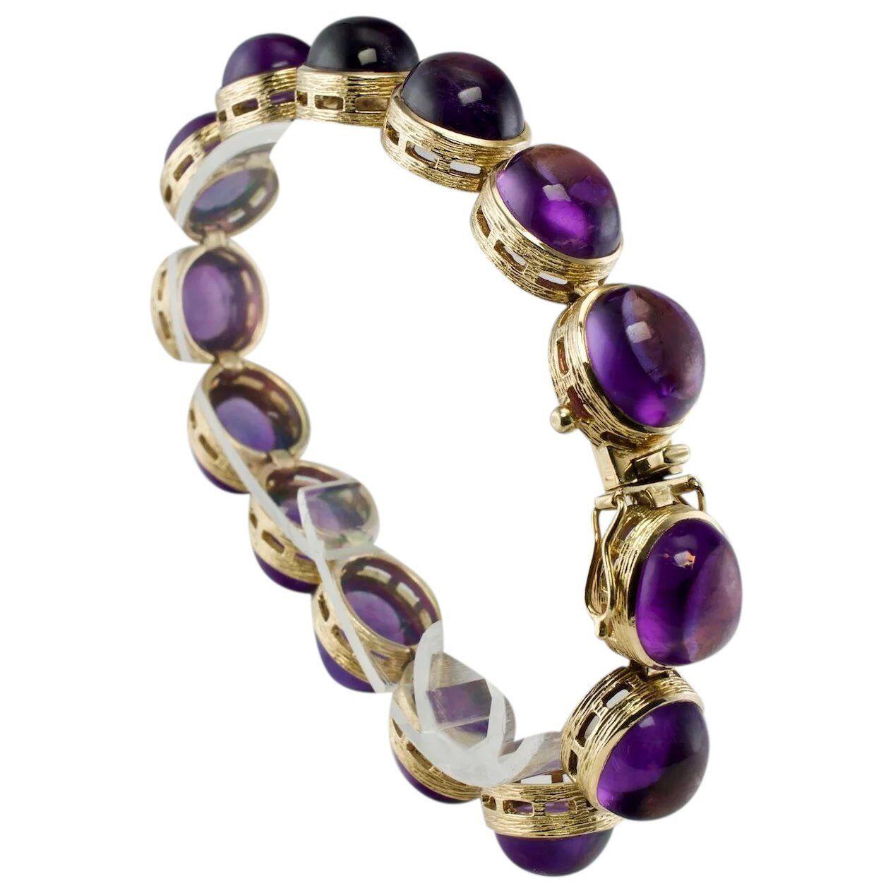 Amethyst Bracelet Cabochons 14K Gold 32.06 Tcw Vintage

This gorgeous estate bracelet is finely crafted in solid 14K Yellow gold and it is set with genuine Earth mined Amethyst cabochons. Each gem is 10mmx 8mm for the total weight of 32.06 carats.