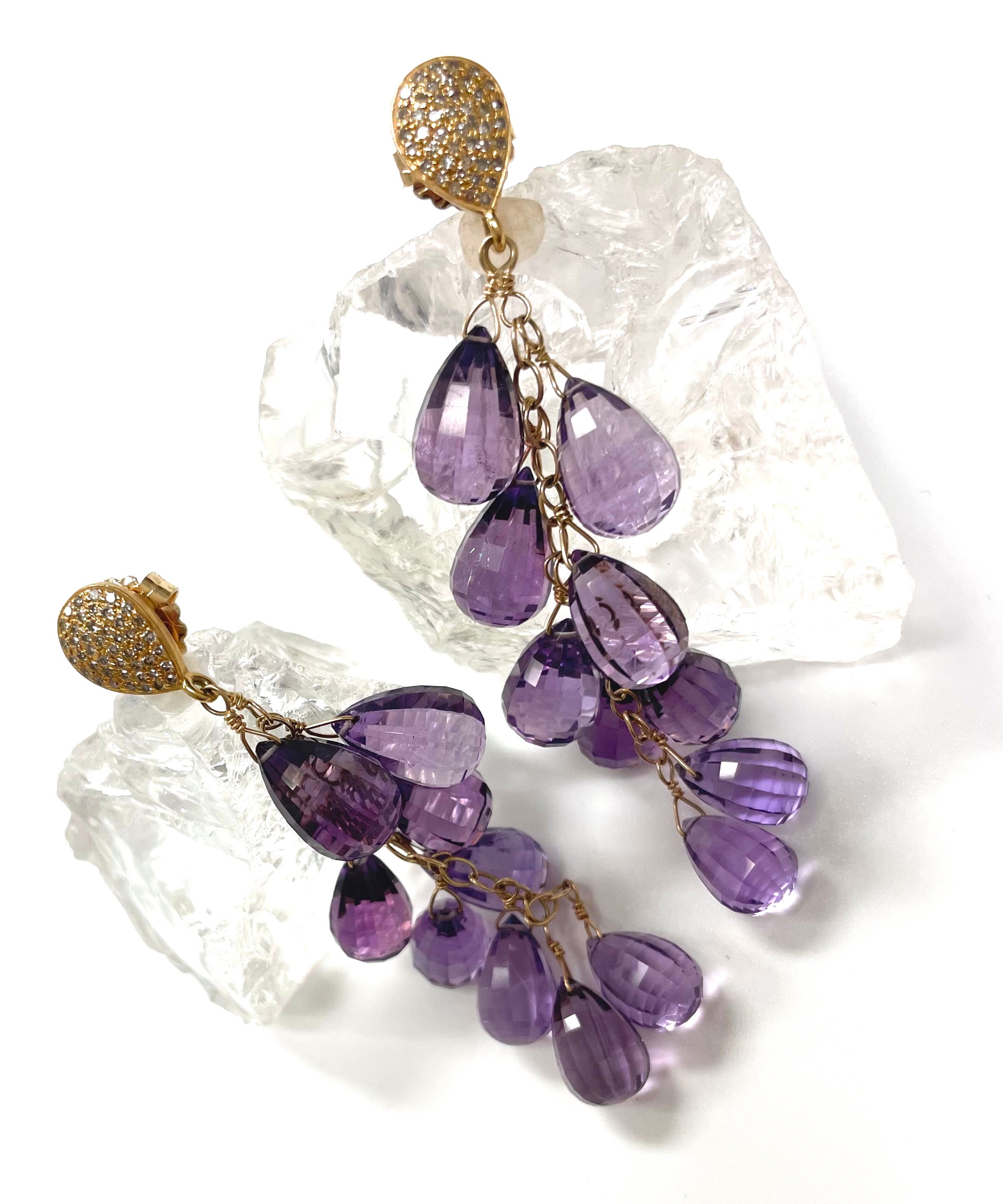 Description
Elegant statement Amethyst briolette dangle earrings, hand wire wrapped in 14 carat yellow gold, suspended from a pave diamond stud.
Item # E3294

Materials and Weight
Amethyst, 99 carats, faceted briolette shape
Pave diamonds Vermeil