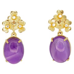 Boucles d'oreilles en or 14k avec cabochon d'améthyste.