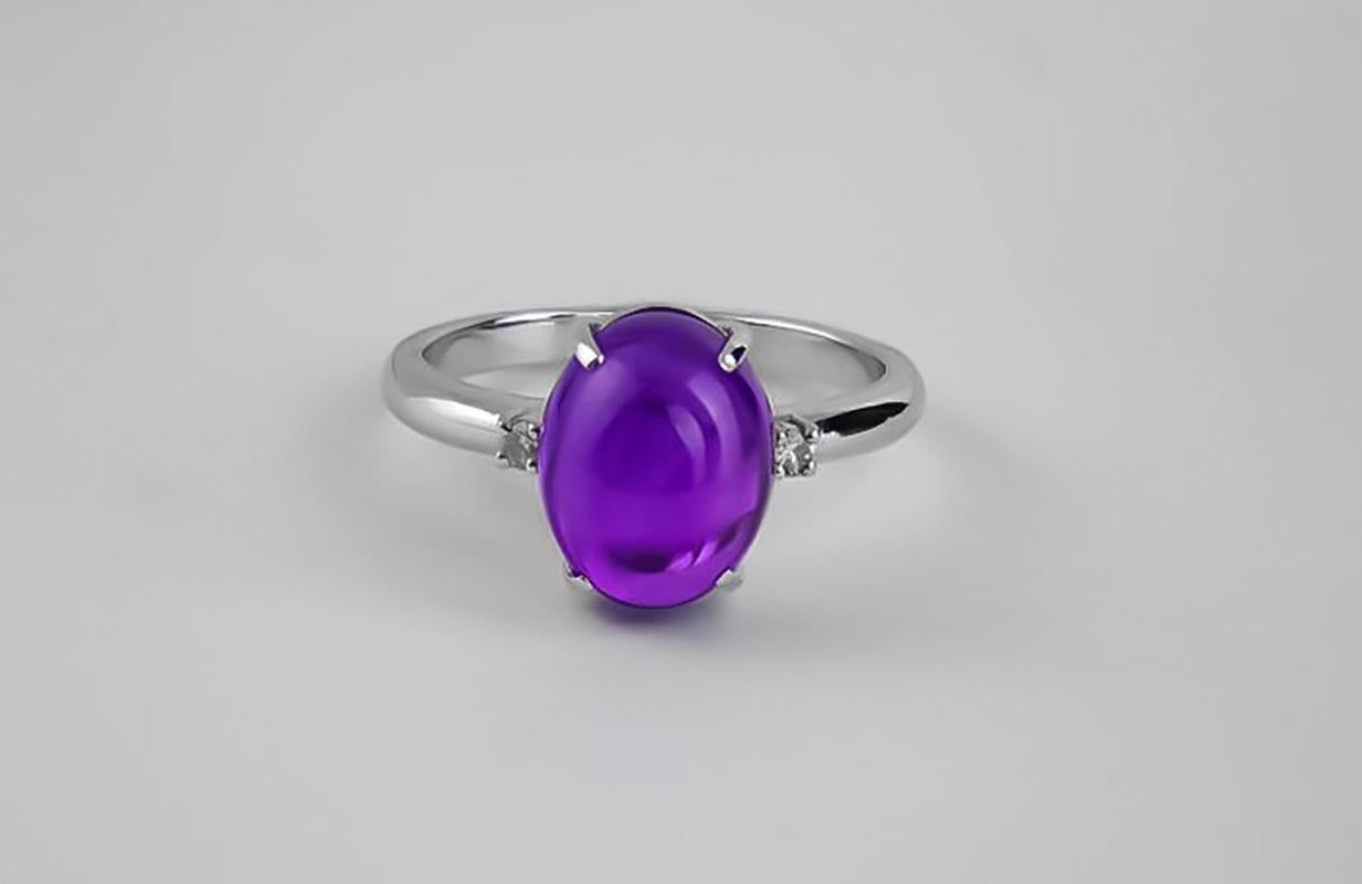Amethyst cabochon and diamonds ring. Minimalist style ring with natural amethyst and diamonds. Purple amethyst ring. Deliсate amethyst ring. 

Metal: 14k gold
Weight: 2.5 g depends from size
 
Set with amethyst.
4.79 ct. oval cabochon cut amethyst.