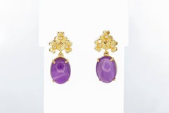 Boucles d'oreilles en cabochon d'améthyste.