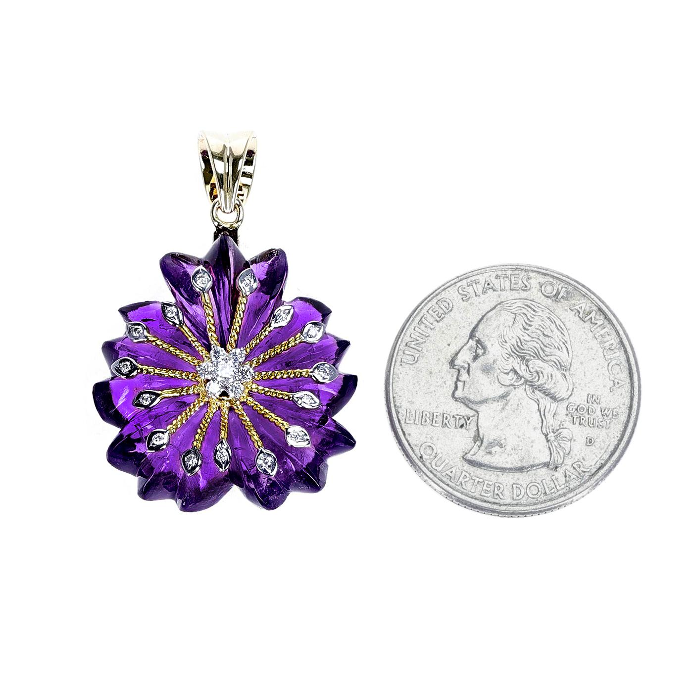 An Amethyst Carved Floral Pendant with 14k Gold and Diamonds. Length: 1.25 inches. The total weight of the pendant is 7 grams. The amethyst is appx. 25 carats and the diamonds weigh appx. 0.22 carats. 