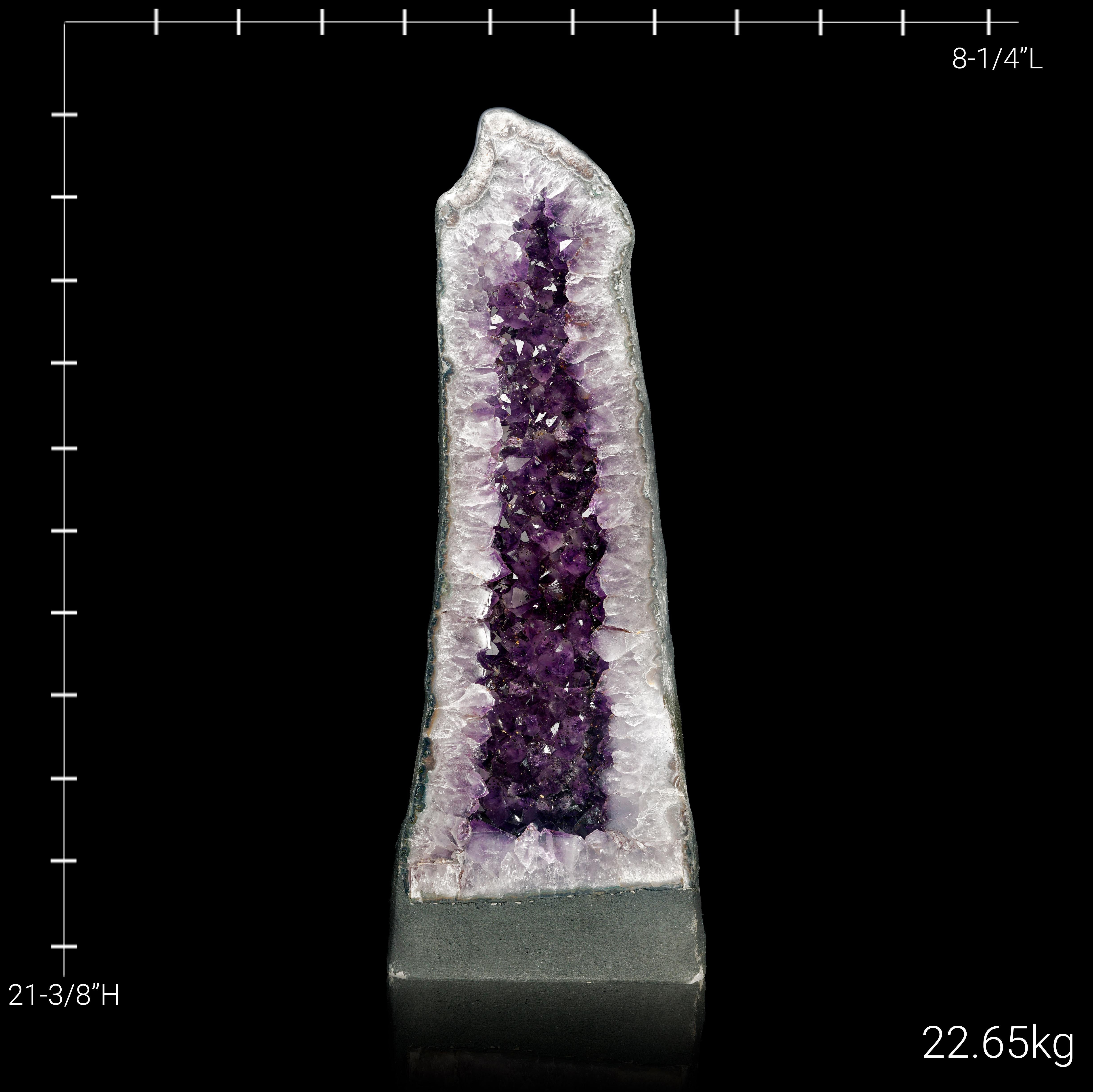 This sleek and elegant Amethyst Cathedral from Brazil showcases a striking column of vibrant purple crystals surrounded by a polished outer edge. The tall and slender design highlights the intricate beauty of the amethyst, making it a captivating