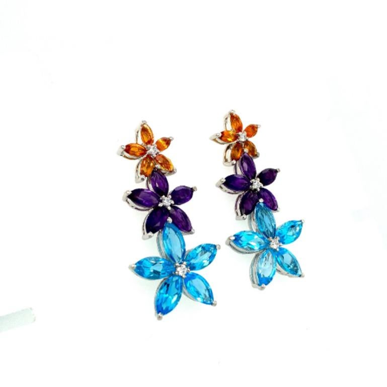 These gorgeous Amethyst, Citrine and Topaz Flower Dangle Earrings are crafted from the finest material and adorned with dazzling amethyst, citrine and blue topaz where citrine is associated with positivity, abundance and success, blue topaz improves