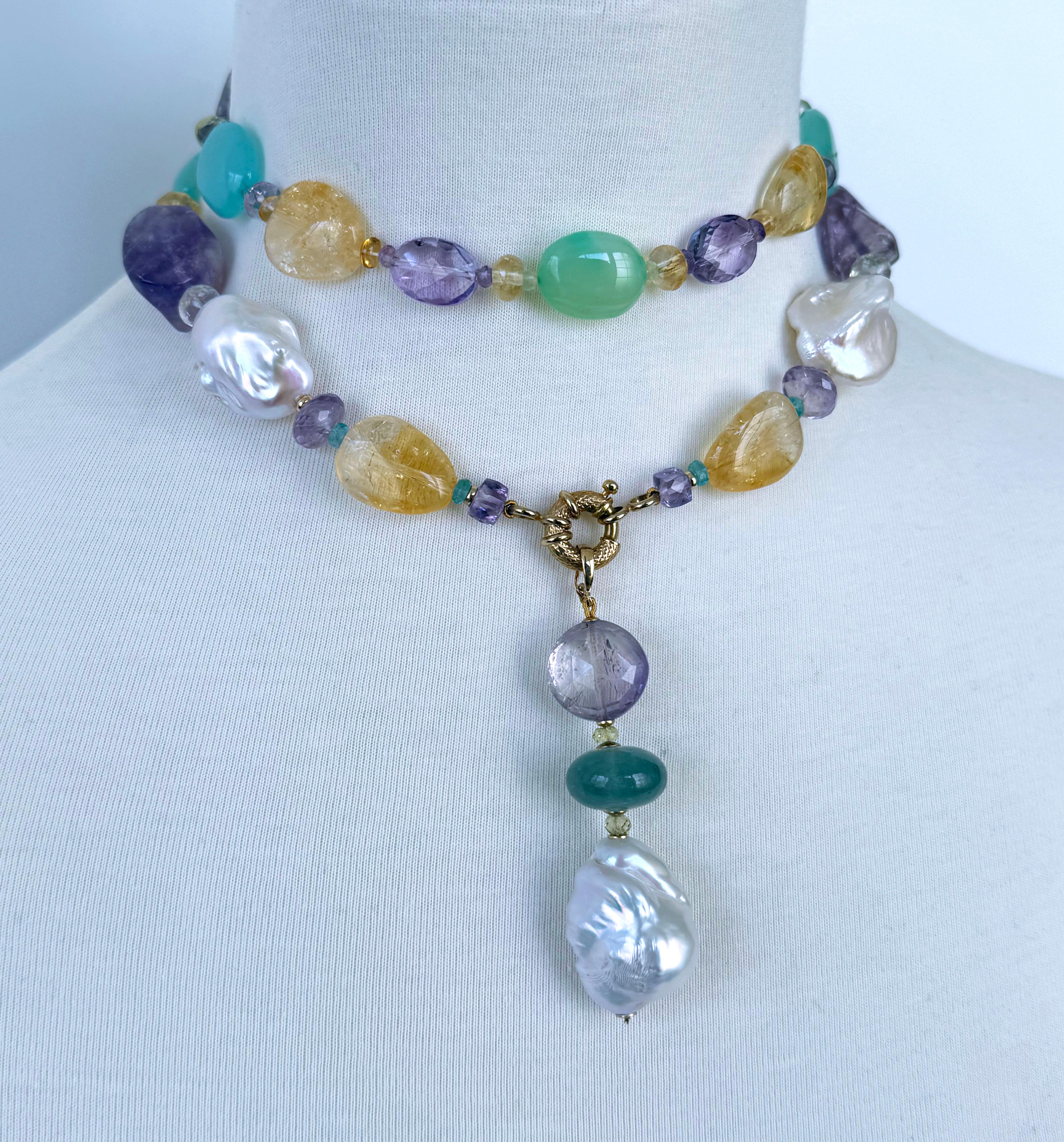 Magnifique Sautoir fermé en pierre de mutli par Marina J.

Ce collier est composé de pierres et d'accessoires multicolores, dont l'améthyste, l'améthyste verte, la citrine, la calcédoine, la topaze bleue, des perles baroques et de l'or jaune 14k
