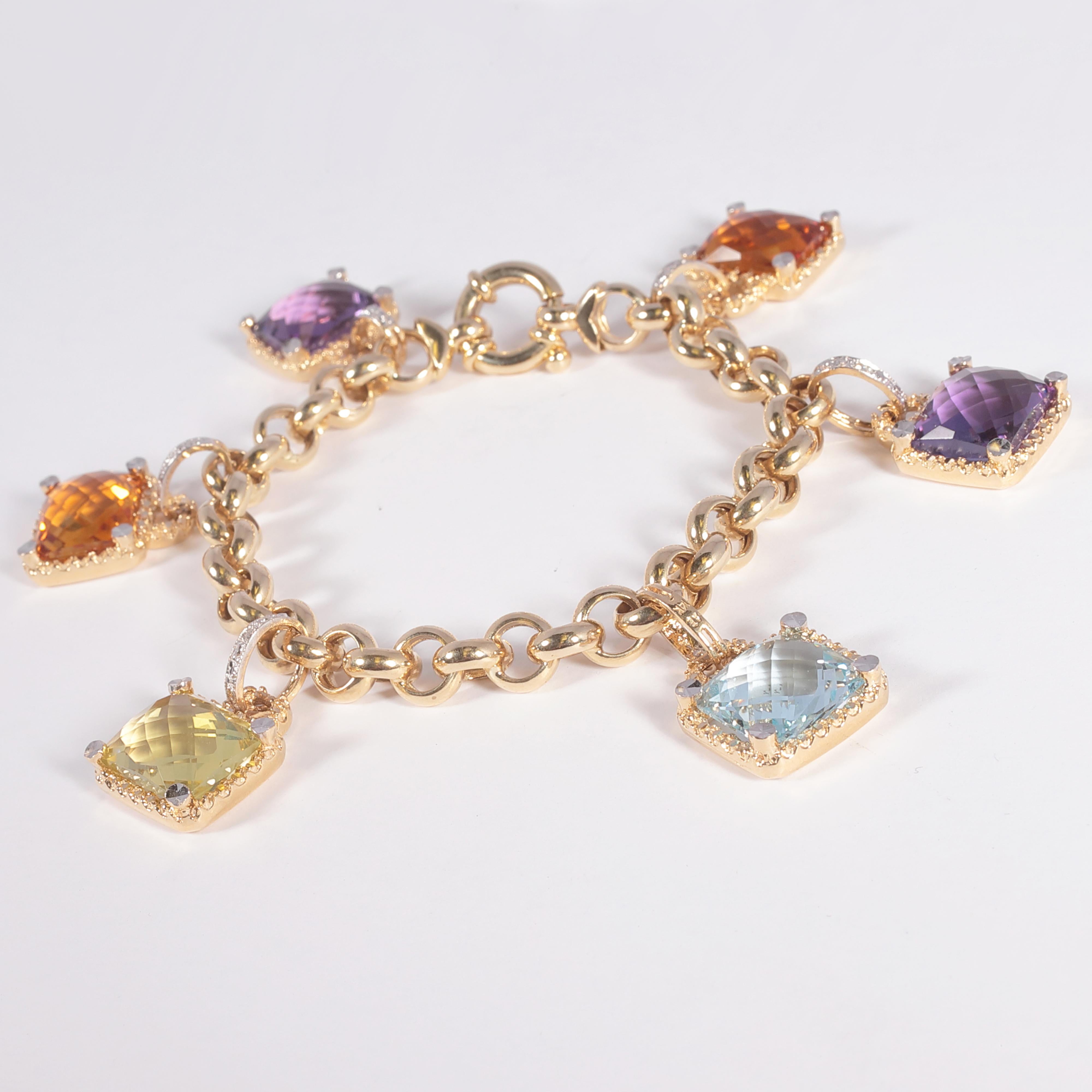 This bracelet features amethyst, blue topaz, citrine, and peridot charms with diamond accents.   The stones average 12.00 mm x 10.00 mm x 6.30 mm and have an estimated total weight of 33.50 carats. The bracelet is 7 1/4 inches long.