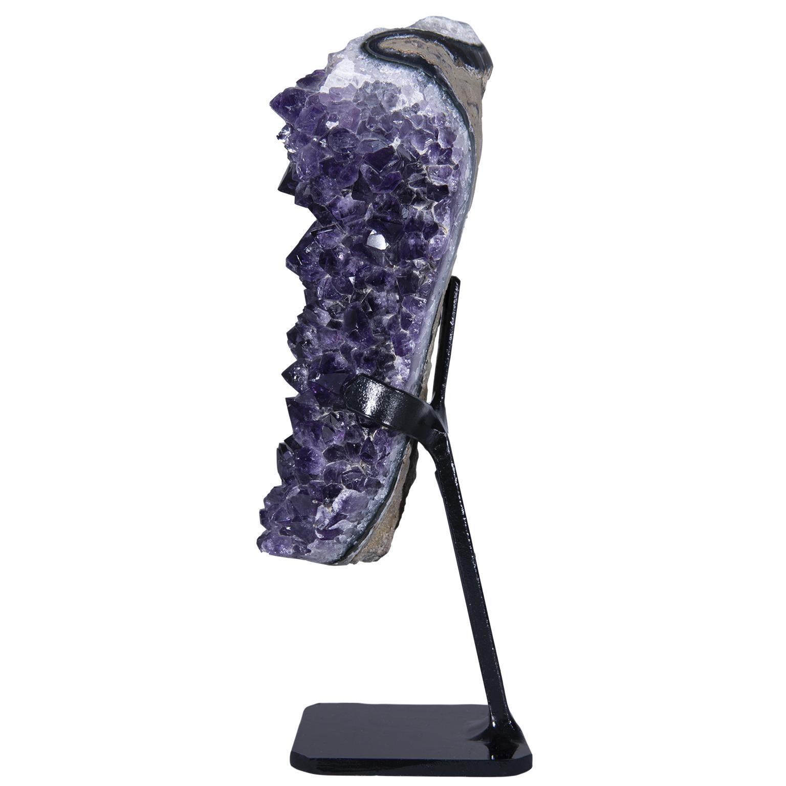 A stunning rough amethyst cluster with calcite formation on top.

The exquisite amethyst cluster has a beautiful deep purple color, with impressive peak size combined with white quartz, green celadonite and blue-gray agate

To further add to its