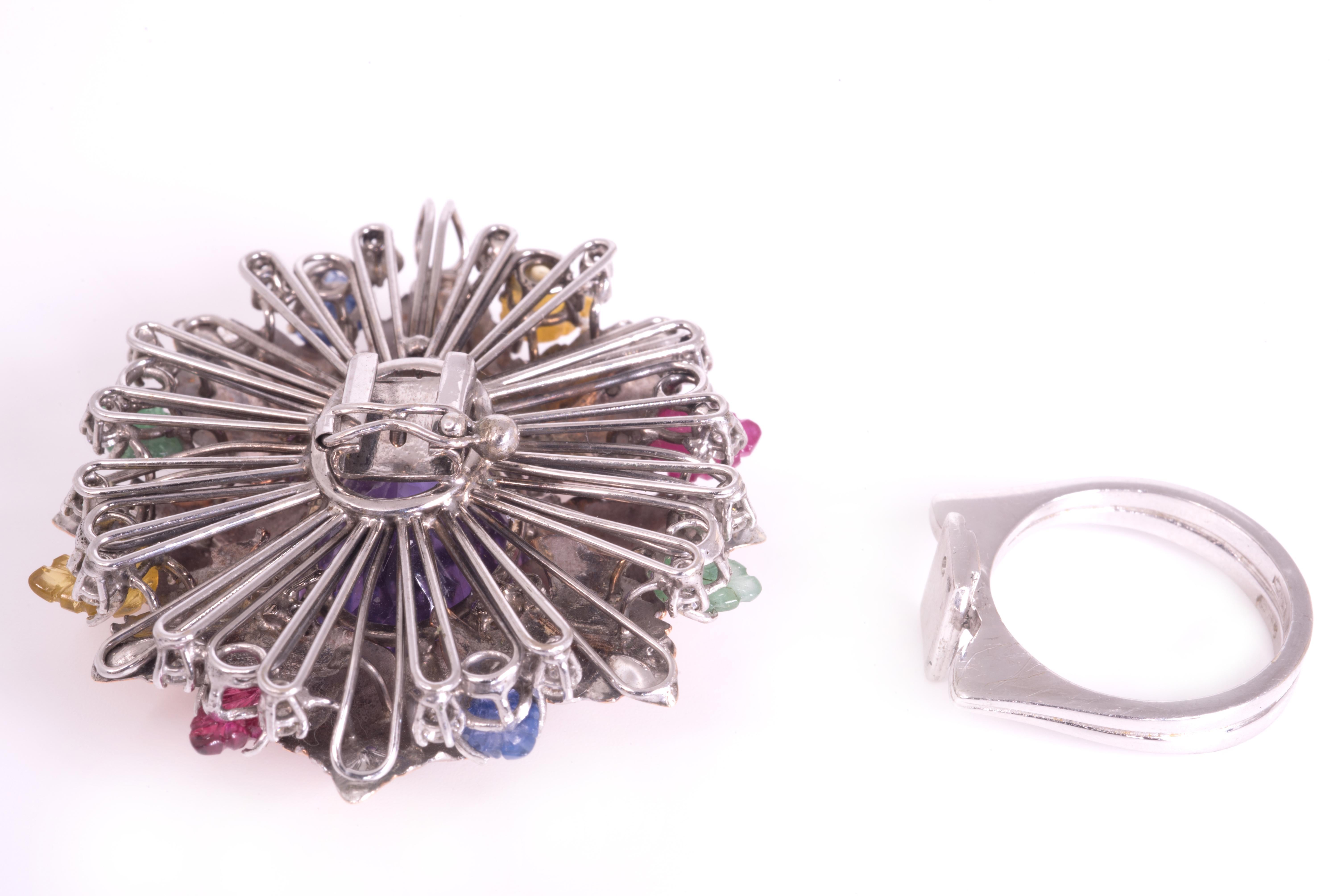 Flower ring in white and rose gold 18 kt engraved, it disassembles and becomes a pendant with brilliants ct 0,48 and leaves of sapphires ct 0,30, rubies ct 0,30, emeralds ct 0,30, yellow sapphires ct 0,30 and central oval amethyst ct 14