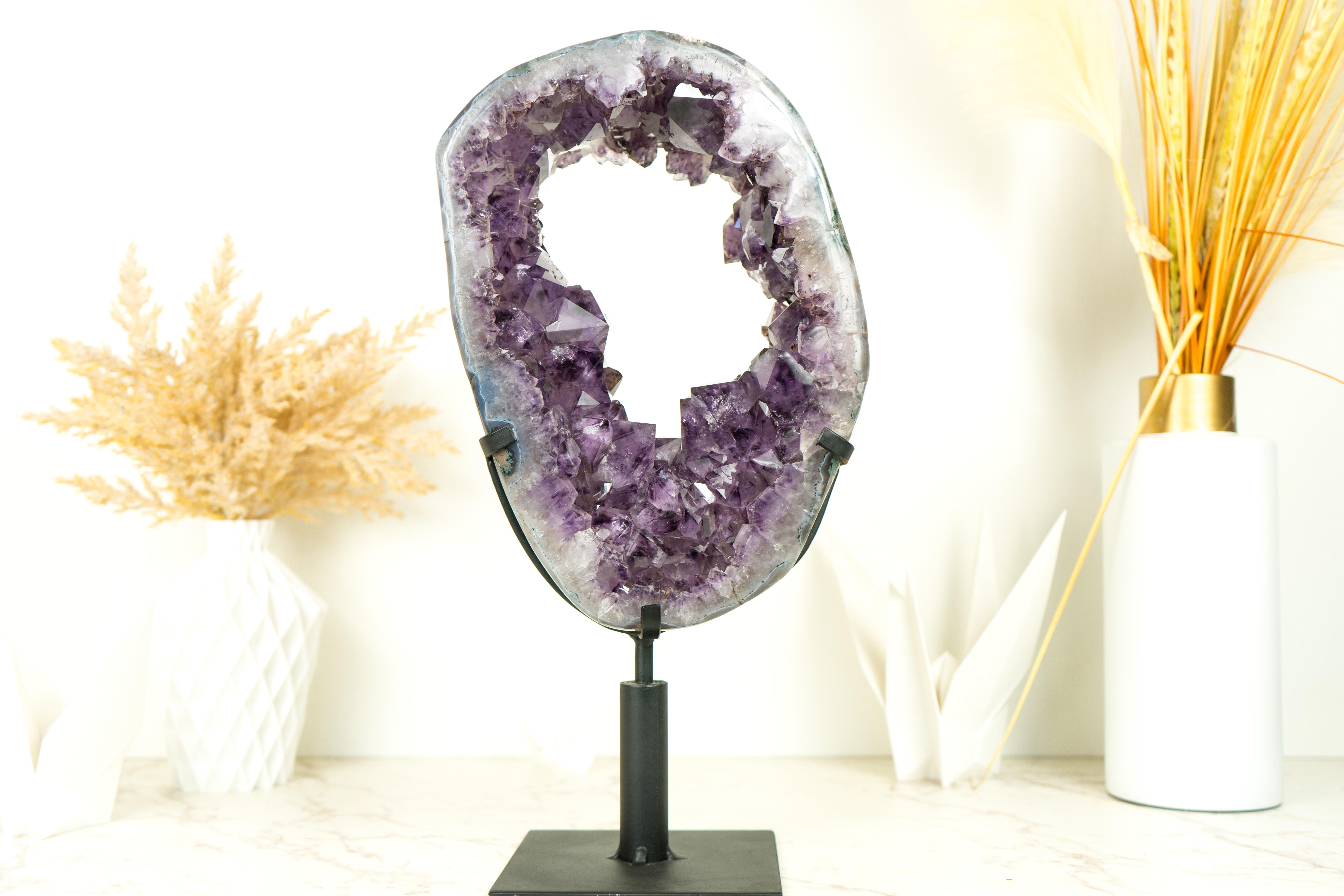 Amethyst Geodes with Crown Formations are a rare form of Amethyst found exclusively in one mine. Unlike the usual amethyst druzy Formations, these geodes exhibit crystal points that create a crown-like structure, making them truly exceptional
