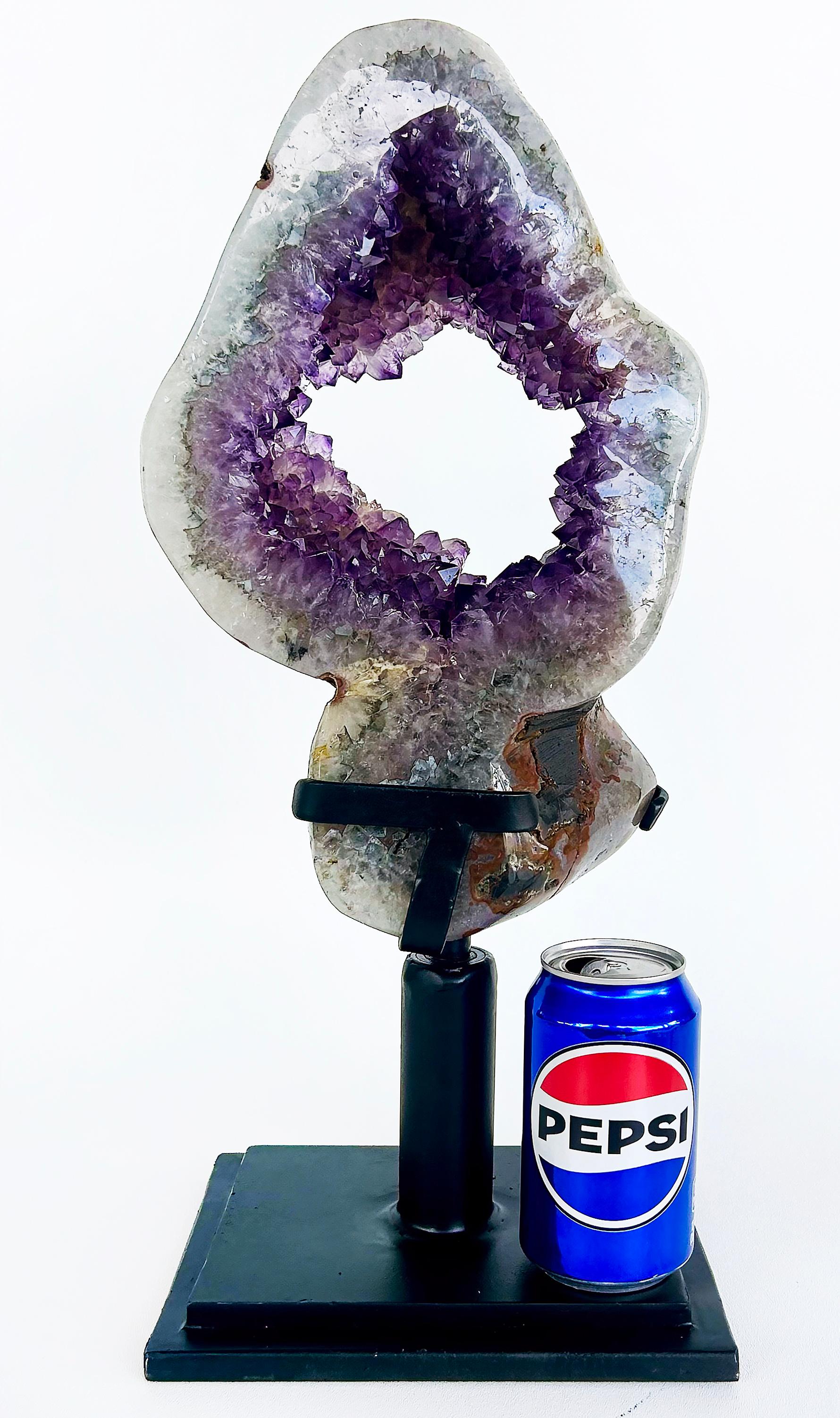 Amethyst Crystal Geode (Uruguay) Weighing 23 lbs. on Custom Made Spinning Stand

Offered for sale is a large and usually formed Amethyst Crystal Geode from Uruguay.  The Amethyst from Uruguay is known for for it's derp rich purple color.  This geode