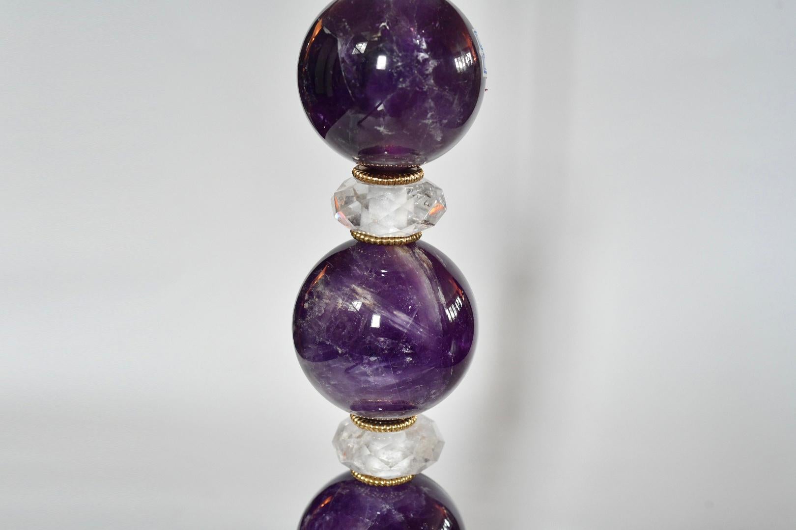 Pair of stacked spheres of amethyst crystal with fine cast gilt brass bases. Created by Phoenix Gallery, NYC.
Measures: To the top of amethyst 18
