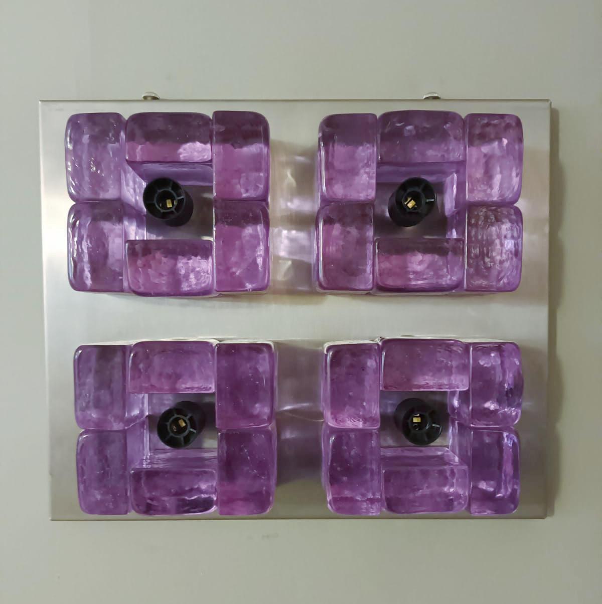 Vintage Italian wall lights or flush mounts with hand blown amethyst Murano glasses cubes mounted on brushed nickel frames / made in Italy circa 1970s
Measures: height 11.5 inches, width 14 inches, depth 3 inches
4 lights / E12 or E14 type / max