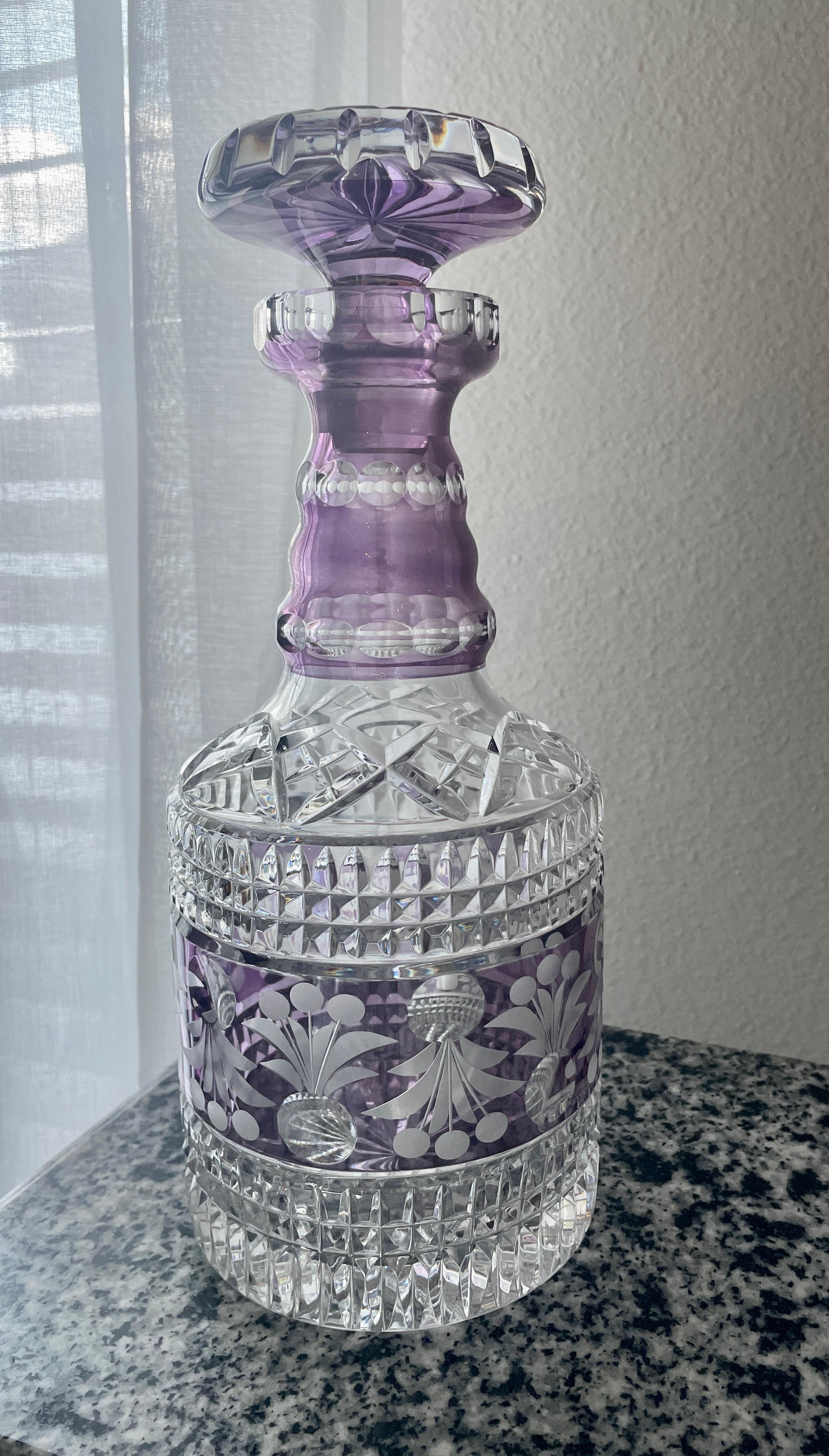  Amethyst color & diamond cut crystal and etched pattern decanter. This piece can be used as barware or a decorative sculpture. 