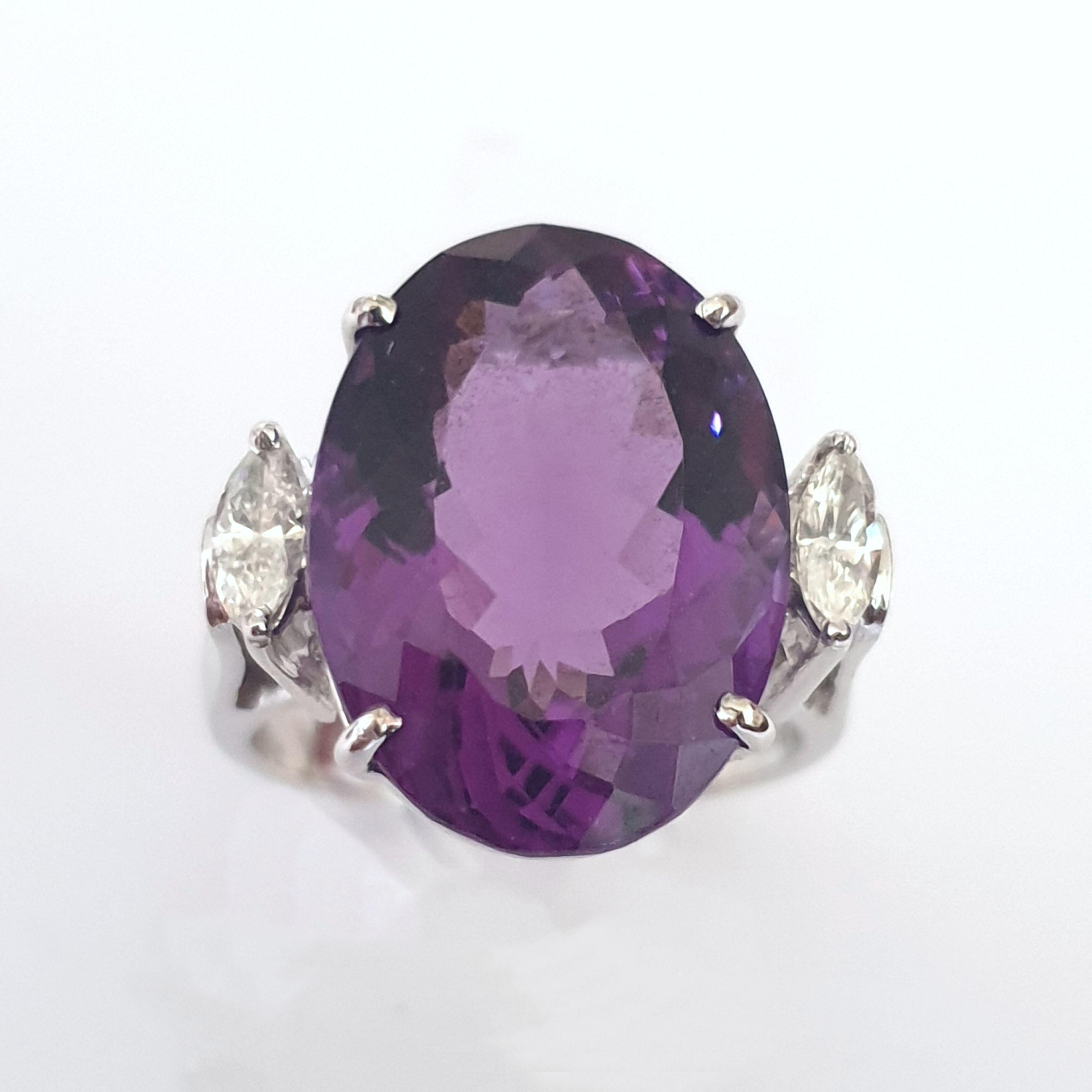 Germany, 1960's . Set with oval shaped amethyst of approximately 9,2 carats. Flanked by two navette-cut diamonds weighing total circa 0,40 ct. Mounted in 14 K white gold. Hallmarked with the purity 585, PNG and tree in triangle. 
Weight: 8,99 grams