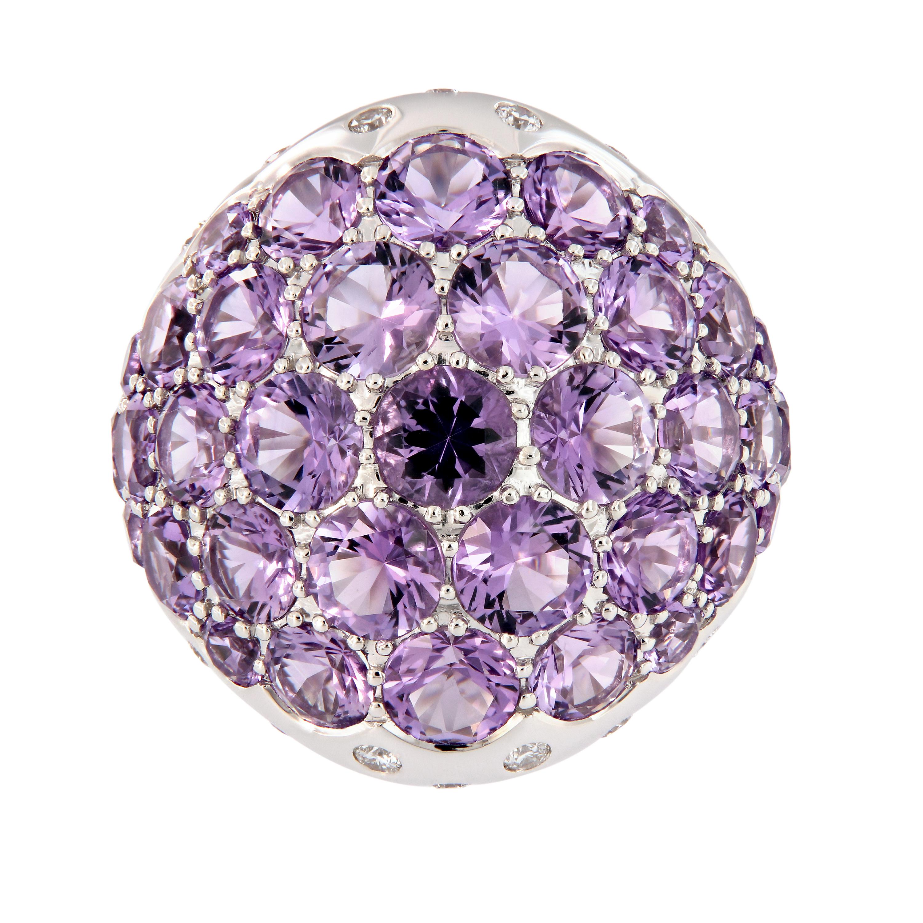 Make a stunning color statement with this 18k white gold dome ring. Ring features round light purple amethyst gemstones in a variety of sizes, accented with diamonds. Ring size is 6.25. Weighs 18.1 grams.

Amethyst 8.90 cttw
Diamond 0.44 cttw