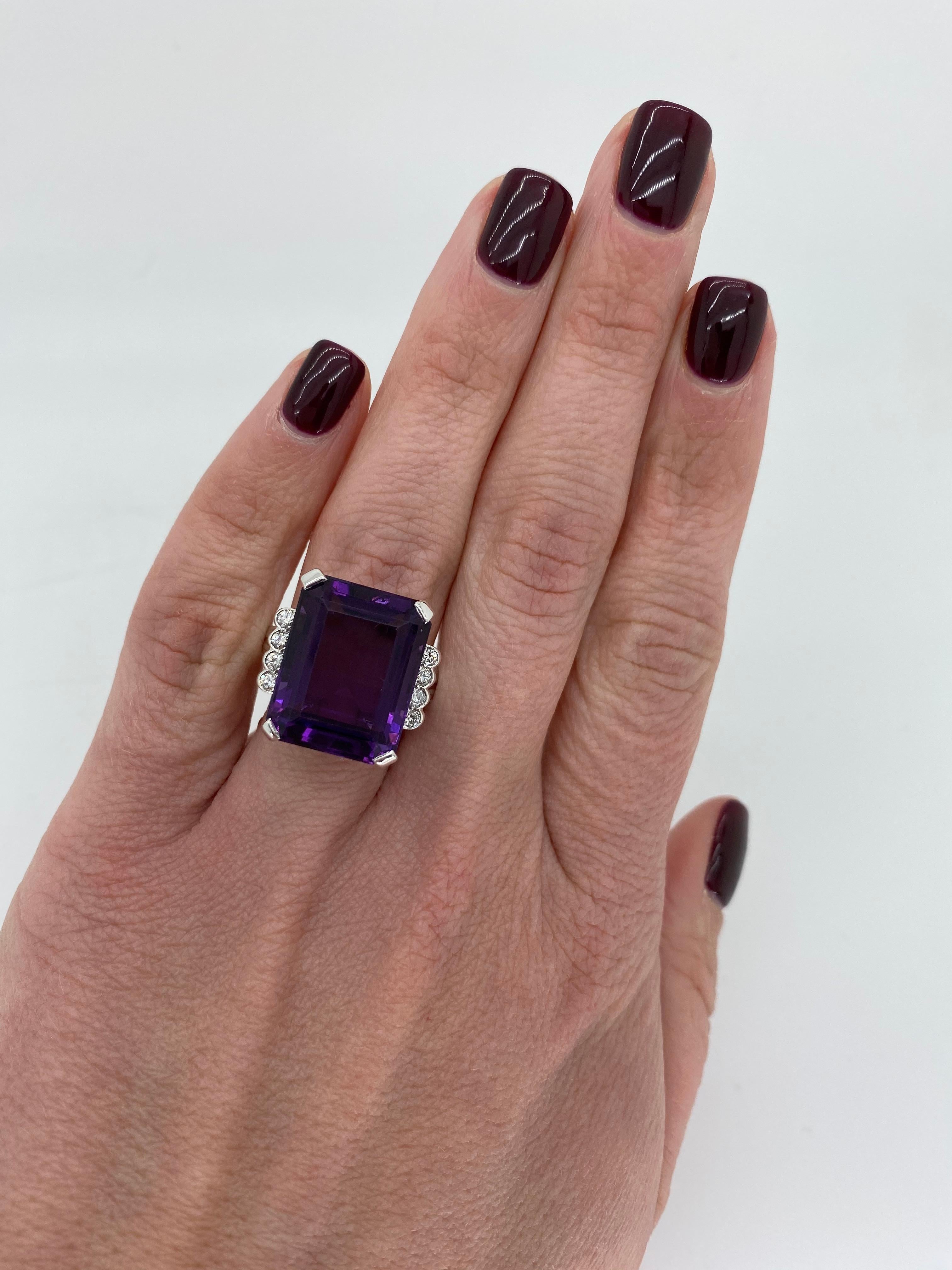 Vintage amethyst and diamond cocktail ring crafted in 14k white gold.

Gemstone: Amethyst and Diamond 
Gemstone Carat Weight: Approximately 17.7x13.8 mm 
Diamond Carat Weight:  Approximately .21CTW
Diamond Cut: Round Brilliant Cut
Color: Average