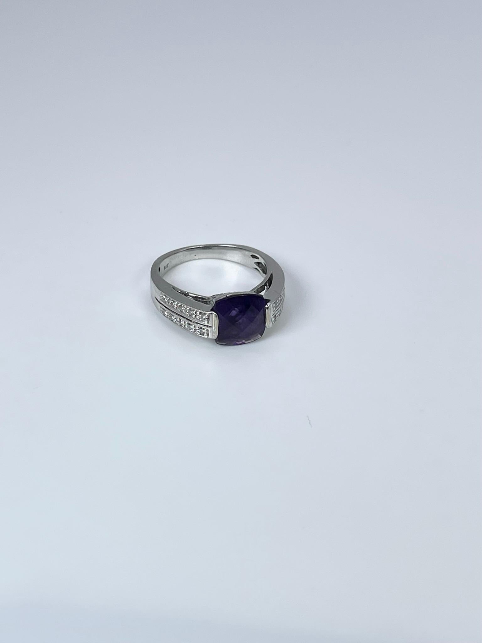 Amethyst & Diamond ring in 14KT white gold. Stunning cocktail ring.

GRAM WEIGHT: 4.55gr
METAL: 14KT white gold

NATURAL DIAMOND(S)
Cut: Round
Color: G-H 
Clarity: SI (average)
Carat: 0.10ct

NATURAL AMETHYST
Cut: Oval
Color: Purple
Clarity: