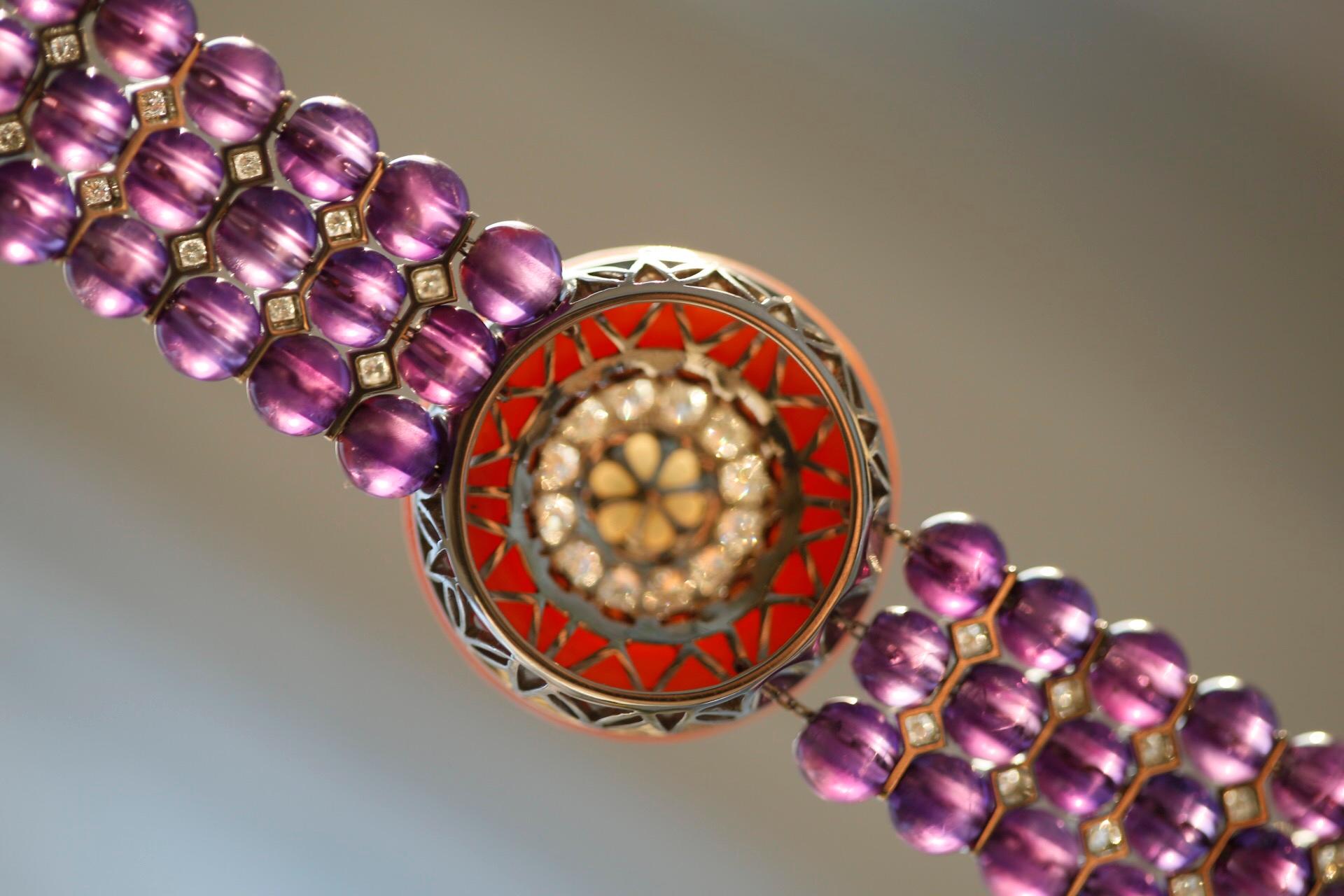 A glorious multi-gem bracelet bursting with colours and tremendous design. 

Beads of amethyst, with expressive colouring of violet tones, embellished with spacers which include two diamonds between every row of three amethyst beads. These help to
