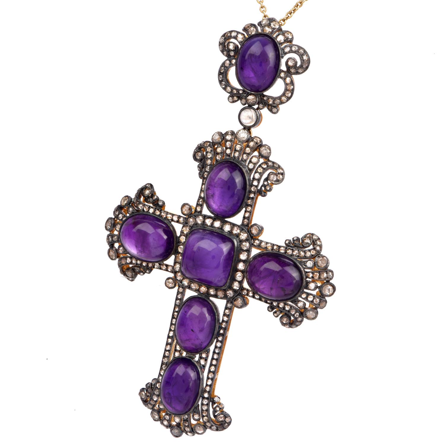 This bold amethyst and diamond cross pendant enhancer & pin brooch is crafted in solid silver and 18k gold  Weighing 26.7 grams and measuring 3.75” long x 2.25” wide. Features 7 prominent bezel-set amethyst cabochons collectively weighing approx.