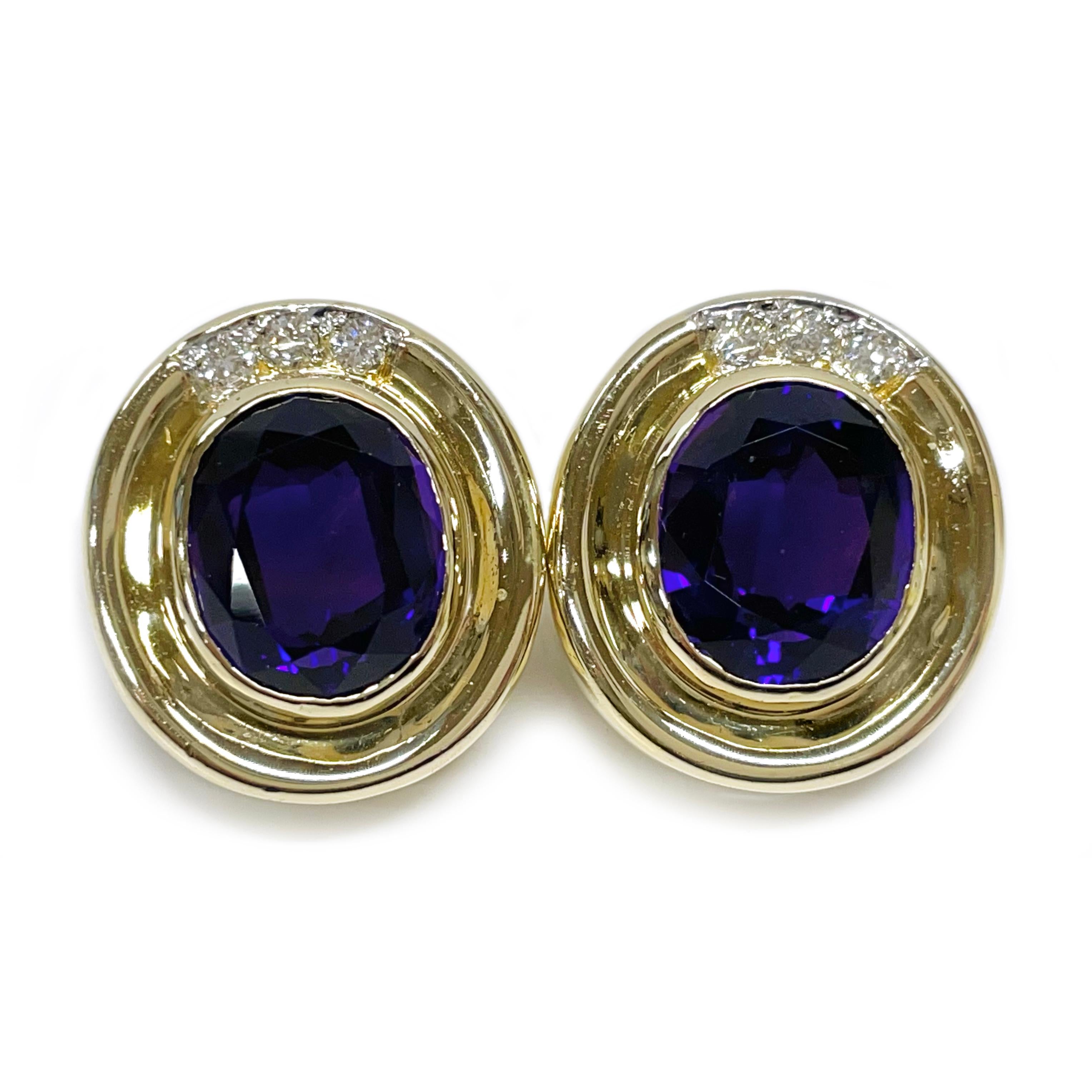 14 Karat Amethyst Diamond Earrings. Each earring features a 11.6 x 9.6mm oval bezel-set Amethyst cabochon 3.25ct with three round 2.5mm diamonds along the the wide gold bezel. The diamonds have a total carat weight of 0.30ct. The earrings have a