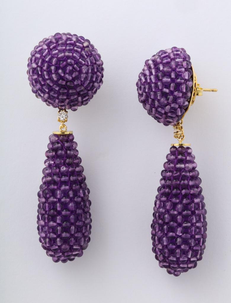 Beaded amethyst button and drop earrings, mounted in 18kt gold with a round diamond connection.
For pierced ears.
Total length 2.75 inches (7cm).
Made in Italy.
Complimentary delivery by Federal Express Priority Service for maximum convenience.