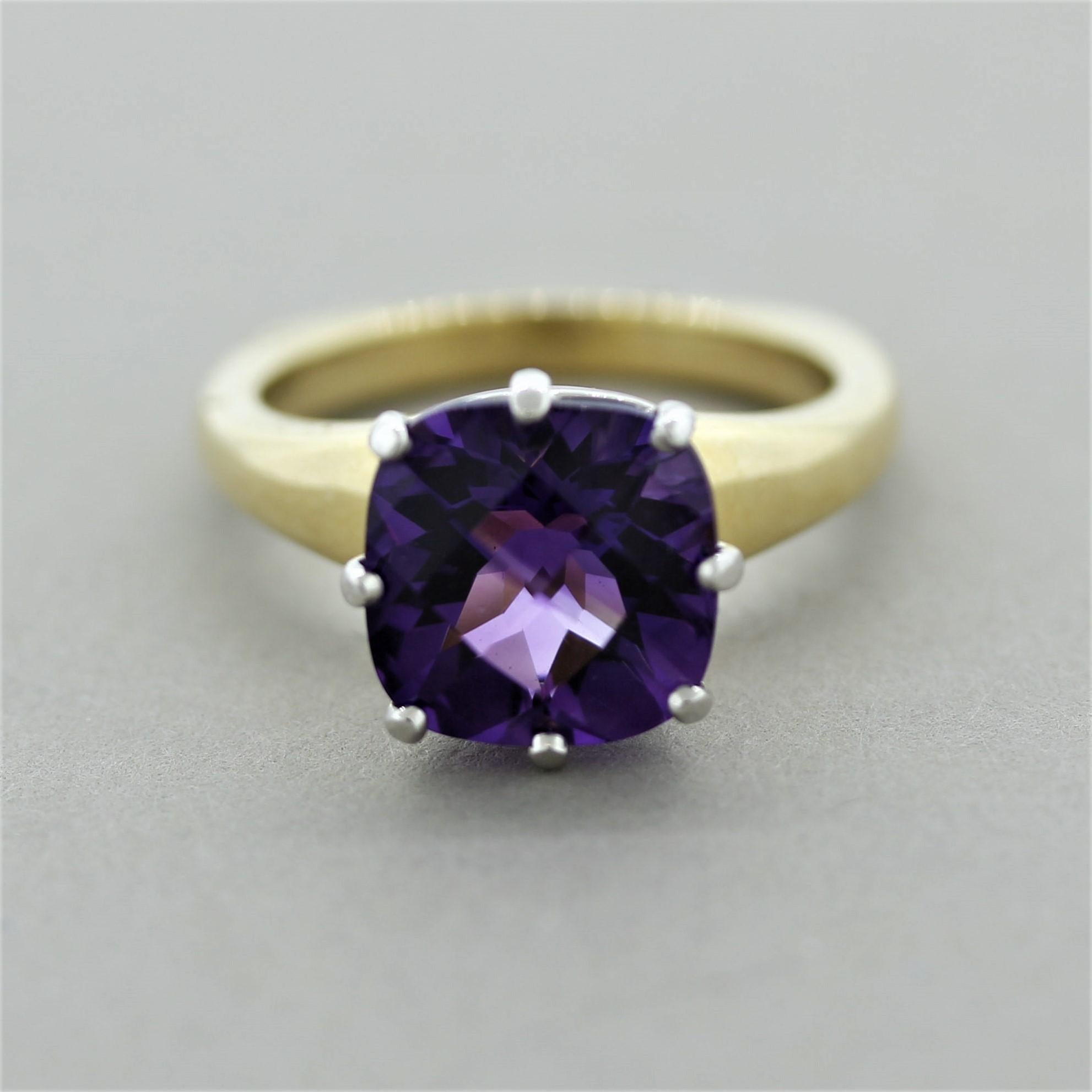 A royal stylish ring featuring a 4.00 carat amethyst with a vivid purple color. The fine gem is cushion shaped with a rose-cut finish and is accented by 0.42 carats of round brilliant-cut diamonds set below it. The amethyst and diamonds are set in