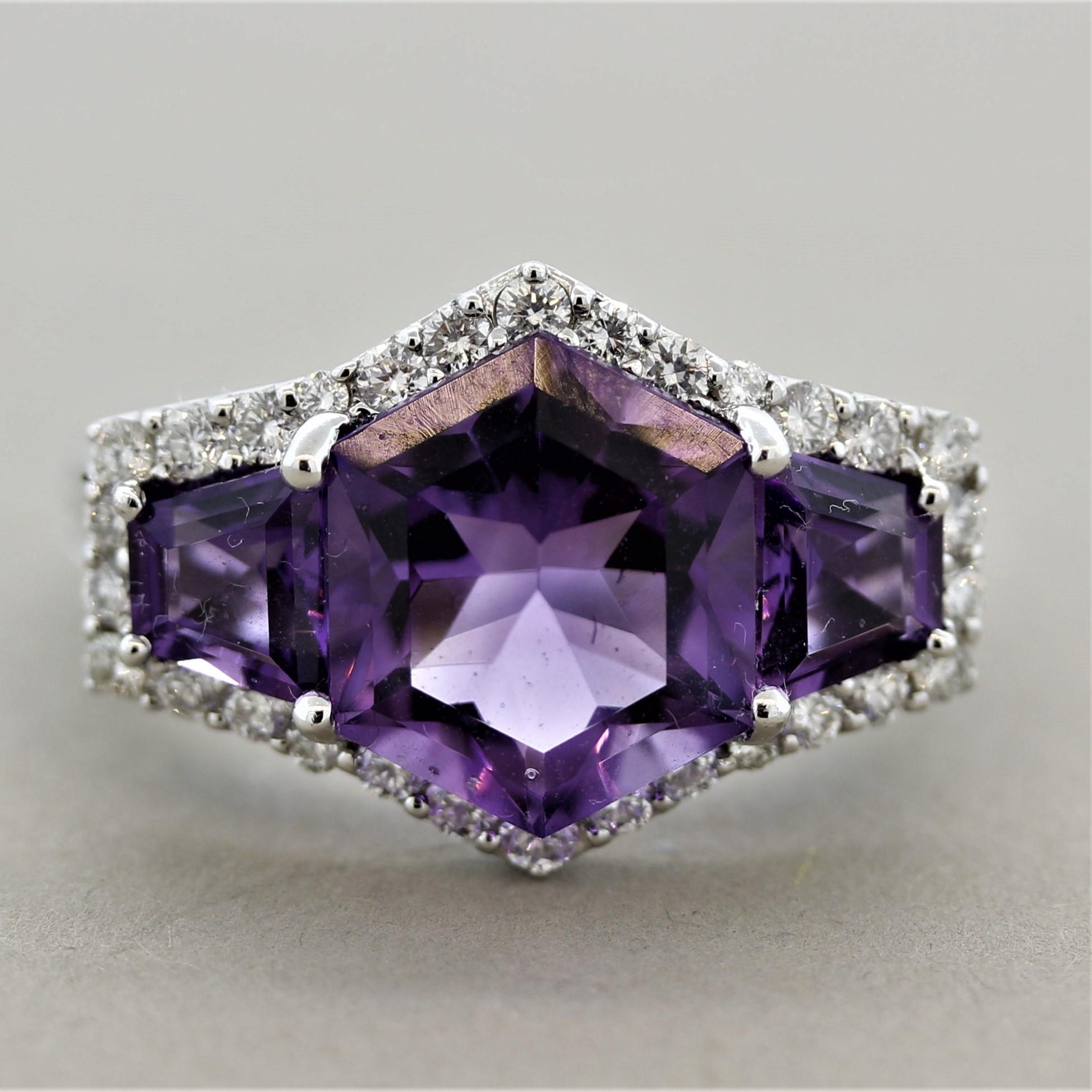 Wow! A special gem-set ring featuring 3 precision cut amethysts weighing 5.00 carats. They are perfectly matching in their vivid and bright purple color. The center amethyst is a hexagonal shape while the two side stones are shield cuts which