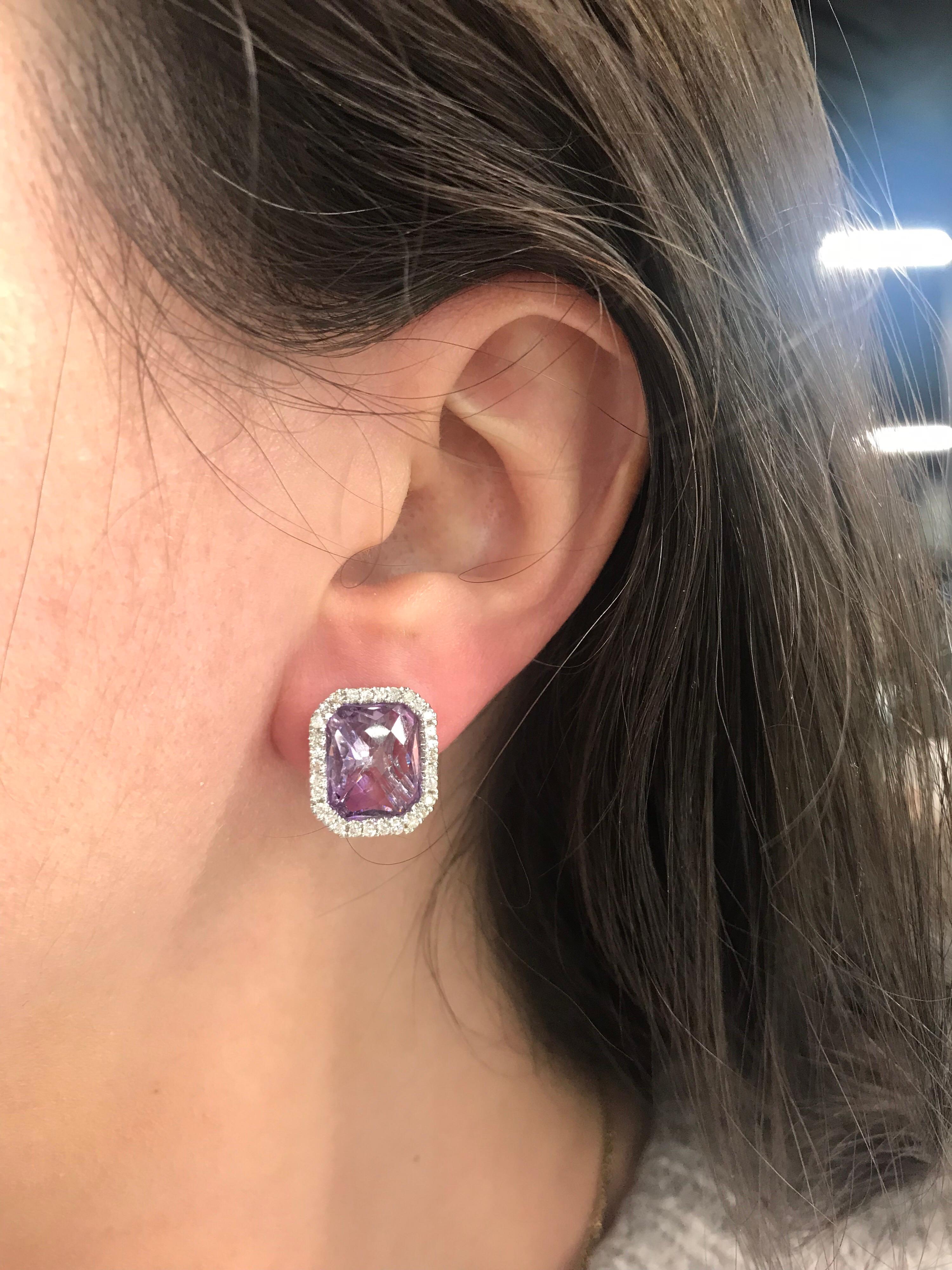 14K White gold stud earrings featuring two cushion Amethysts measuring 11 * 10 mm flanked with round brilliants 0.55 carats.

Comes in a few different gemstones. 