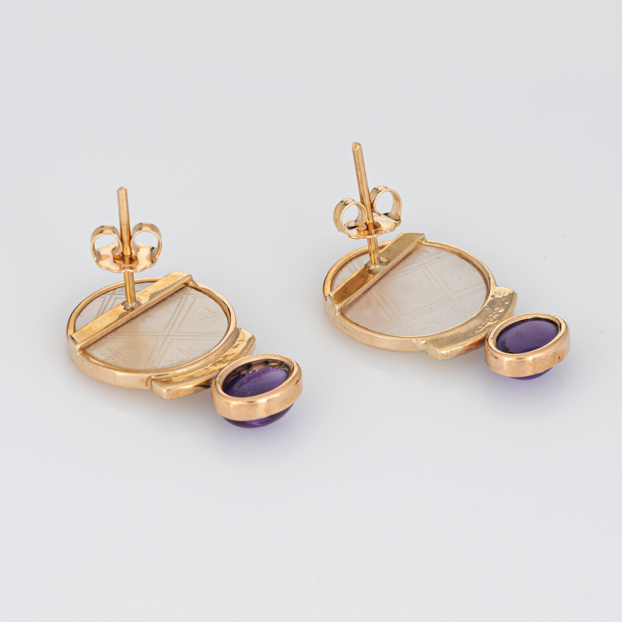 Finely detailed pair of vintage amethyst, diamond and mother of pearl earrings crafted in 14k yellow gold. 

Mother of pearl measures 13mm. Amethysts measure 8mm x 6mm. Diamonds total an estimated 0.06 carats (estimated at H-I color and SI1-I1