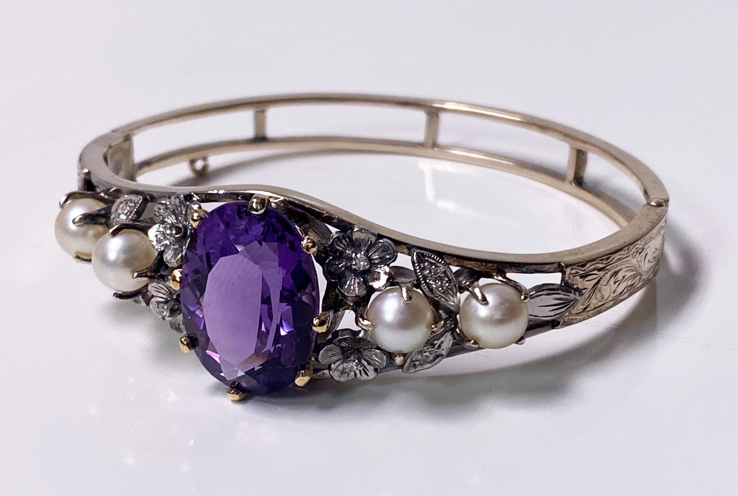 Amethyst Diamond Pearl Gold Bangle C.1930. 14K yellow and white gold, the centre with a fine medium purple Amethyst gauging approximately 17 x 13 x 9.2 mm, approximately 17 cts, four cultured pearls silver white, average 6.00 mm, four brilliant cut