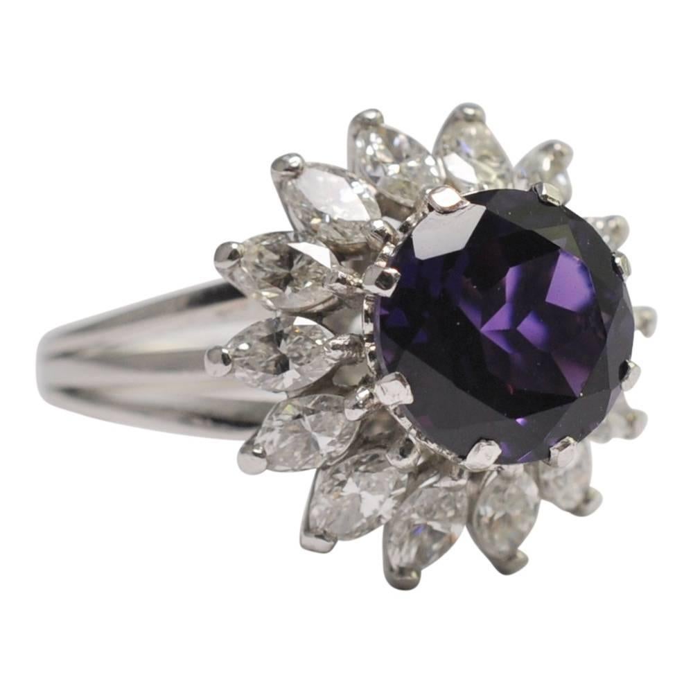 Big, bold and dramatic amethyst and diamond cocktail ring; the deep purple, round amethyst weighs 2.5cts and sits above a gallery of upward slanting, brilliant white, marquise diamonds.  The diamonds weigh 1.75ct and are mounted on a platinum basket
