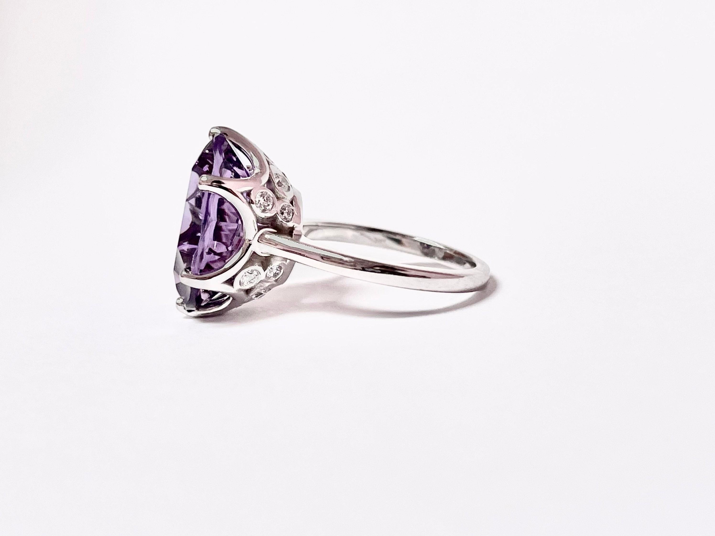 Stunning cocktail ring with large 12mm amethyst and 0.50 carats of fine diamonds VS clarity and F color, the ring is made in 18KT white gold and looks absolutely luxurious from start to finish!

Certificate of authenticity comes with