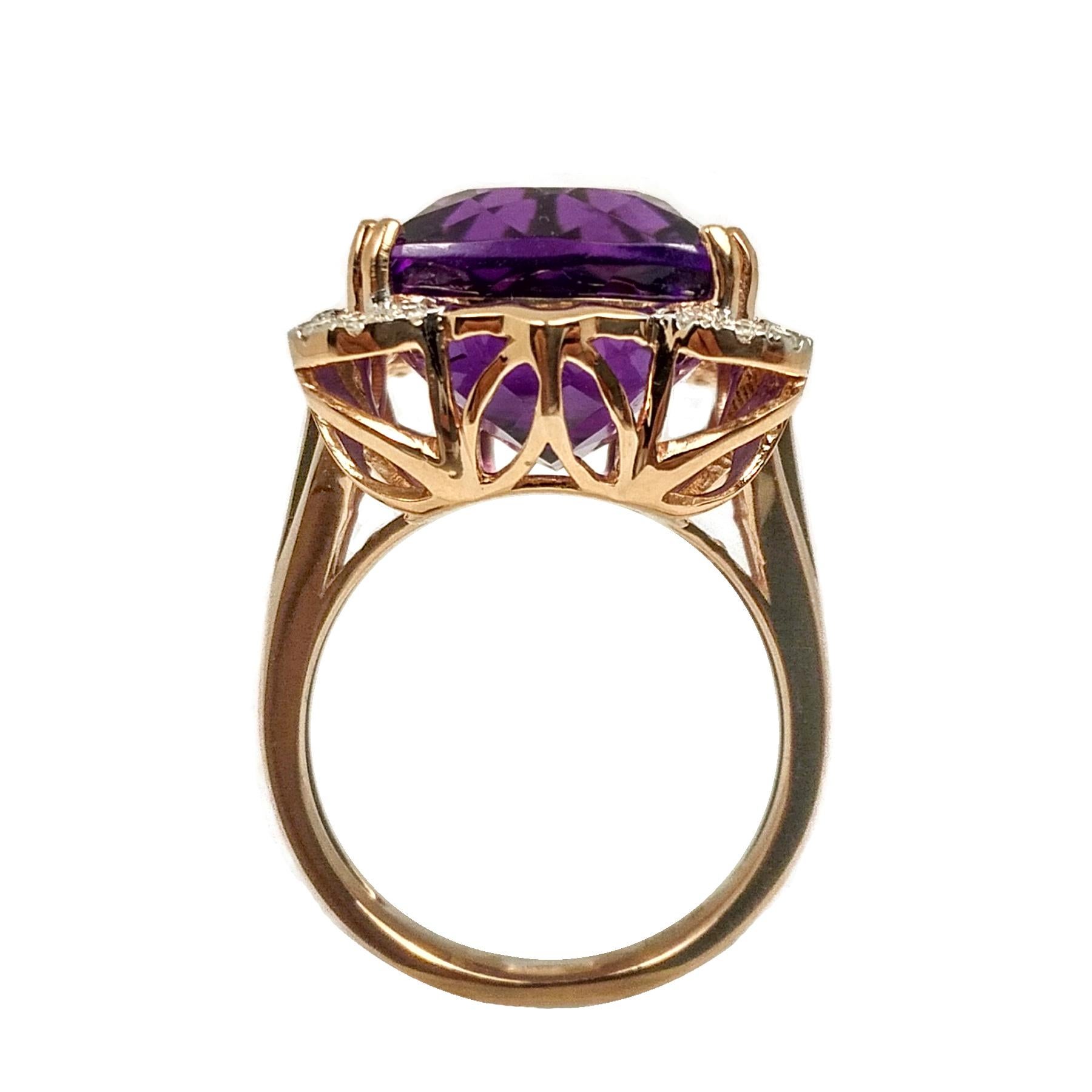 Contemporary, intense purple amethyst and diamond ring. Handcrafted high luster, cushion faceted, amethyst mounted in high profile open basket with 8 prongs, accented with round brilliant cut diamond, set in 14 karats rose gold. Statement cocktail