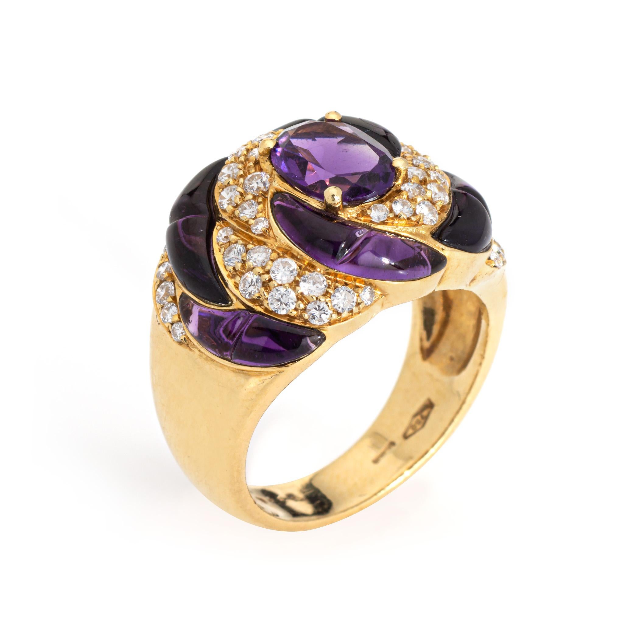Stylish amethyst & diamond ring crafted in 18 karat yellow gold (circa 1980s). 

Diamonds total an estimated 0.40 carats (estimated at H-I color VS2-SI2 clarity). The center set oval faceted amethyst measures 8mm x 6mm. Cilibre cut (cabochon)